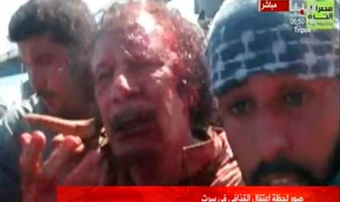 In death as in life, Colonel Gaddafi wins the crazy prize