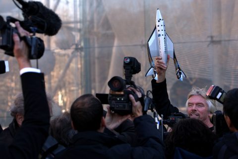 Sir Richard Branson of Virgin Atlantic holds up a model of a spaceship unveiled at a news conference Wednesday January 23, 2008 in New York City.  (Photo by Spencer Platt/Getty Images)