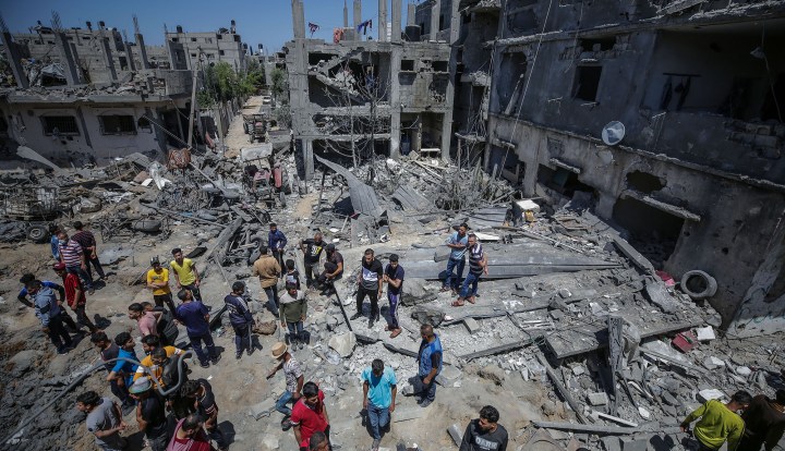 Palestinians inspect their destroyed houses after Israeli air strikes in Beit Hanun town in the northern Gaza strip, 14 May 2021. (Photo: EPA-EFE/MOHAMMED SABER)