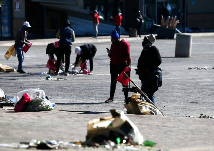 Soweto sweeps up the debris as residents suffer in aftermath of violence