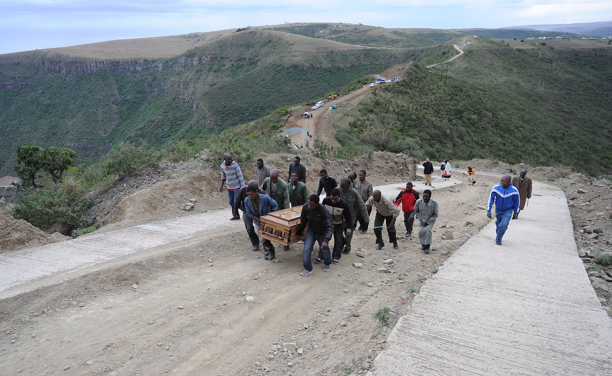 Lonmin mine worker Mafolisi Mabiya is carried up a mountain