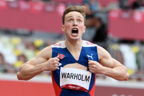 Norway’s Warholm crushes world record to win 400m hurdles gold