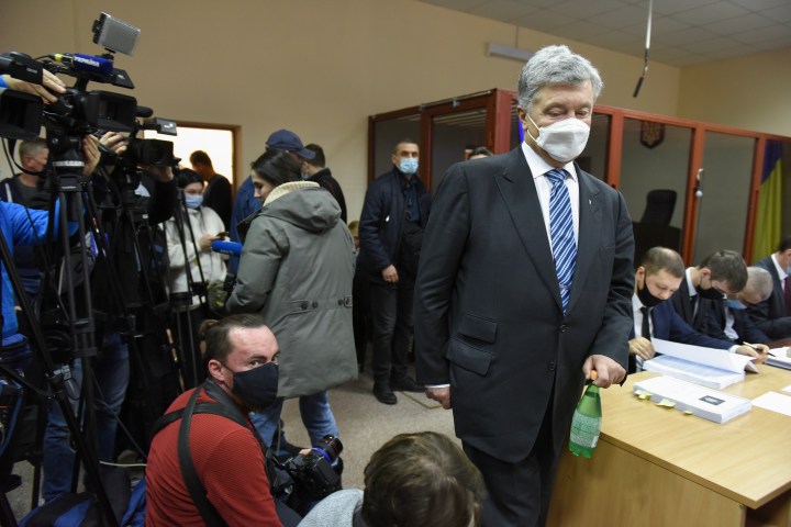 Former Ukrainian president lands in Kyiv to face treason case