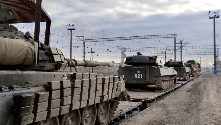 Russia says some troops return to base, Ukraine reacts cautiously