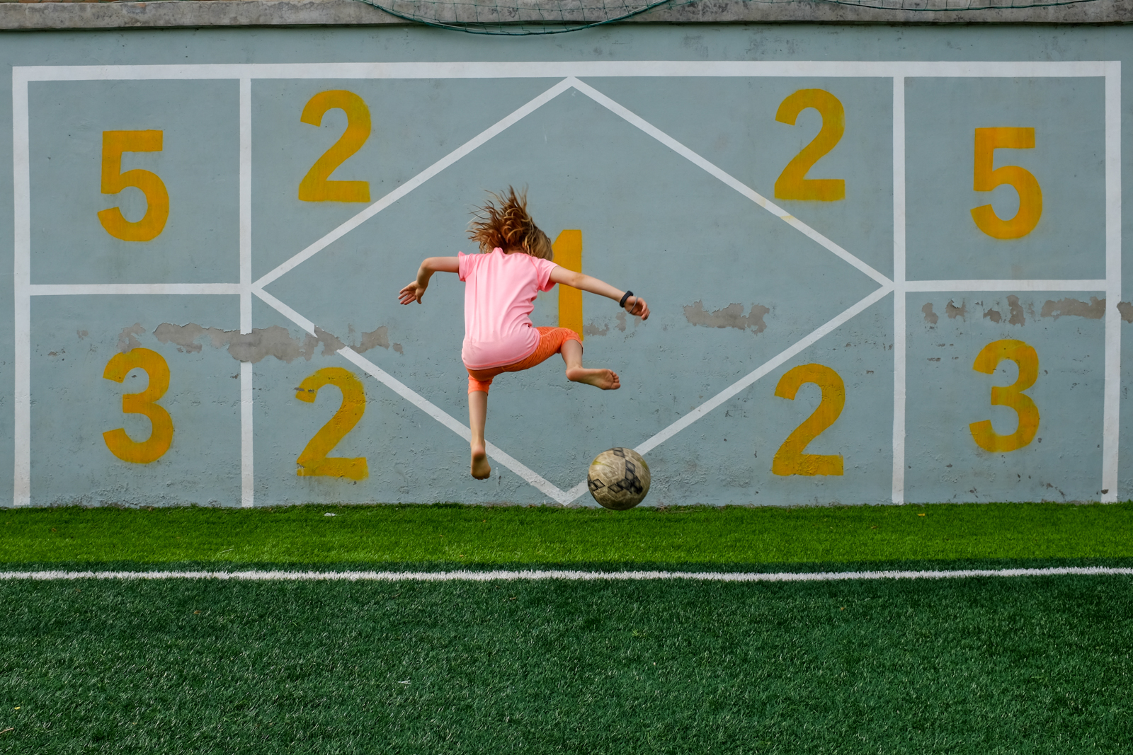 A girl playing soccer