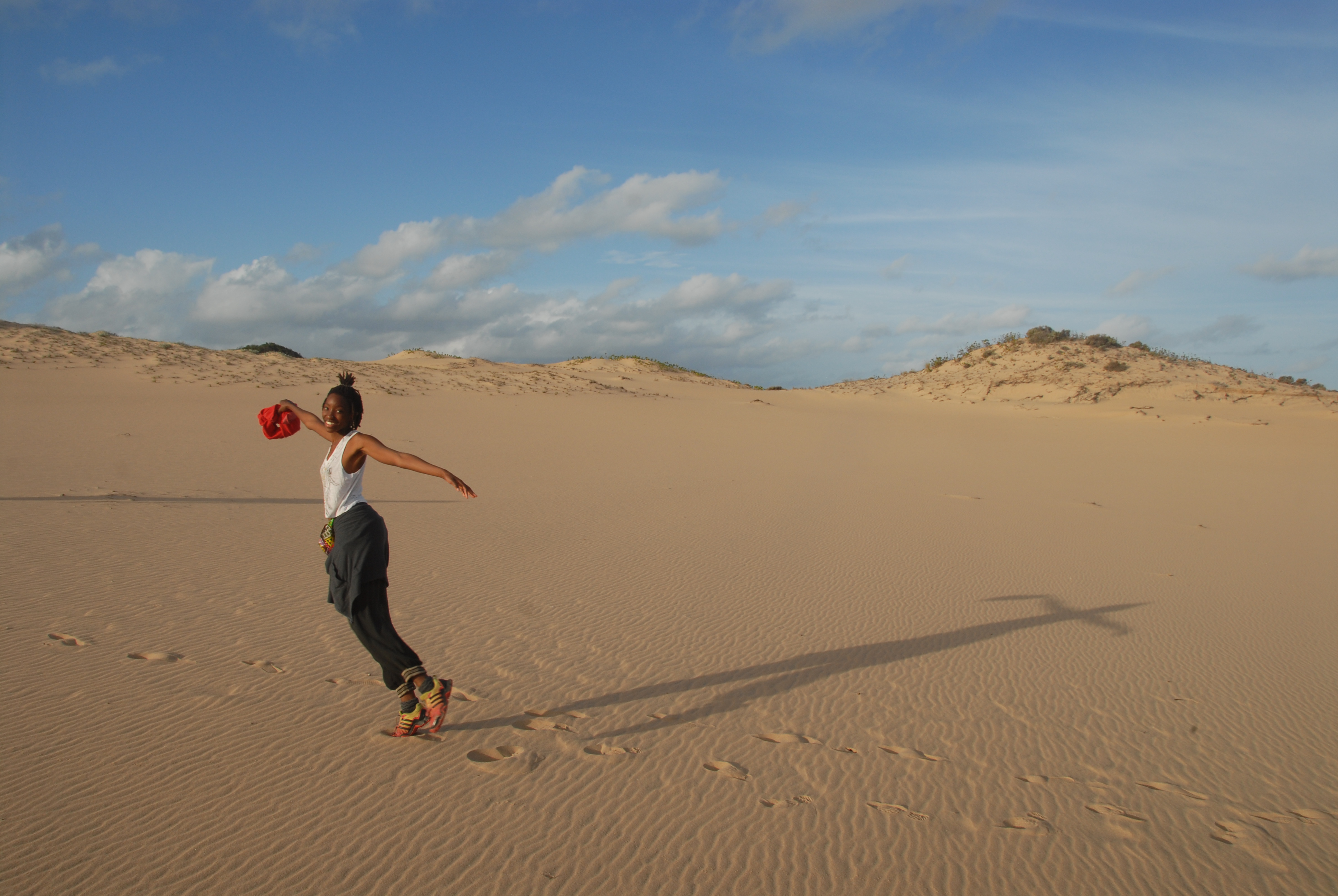 Playing on a sand dune. 