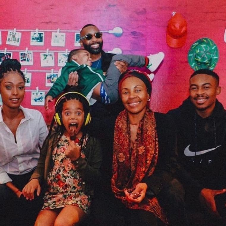Riky Rick and his family. His mother, Louisa Zondo, sits center right. 