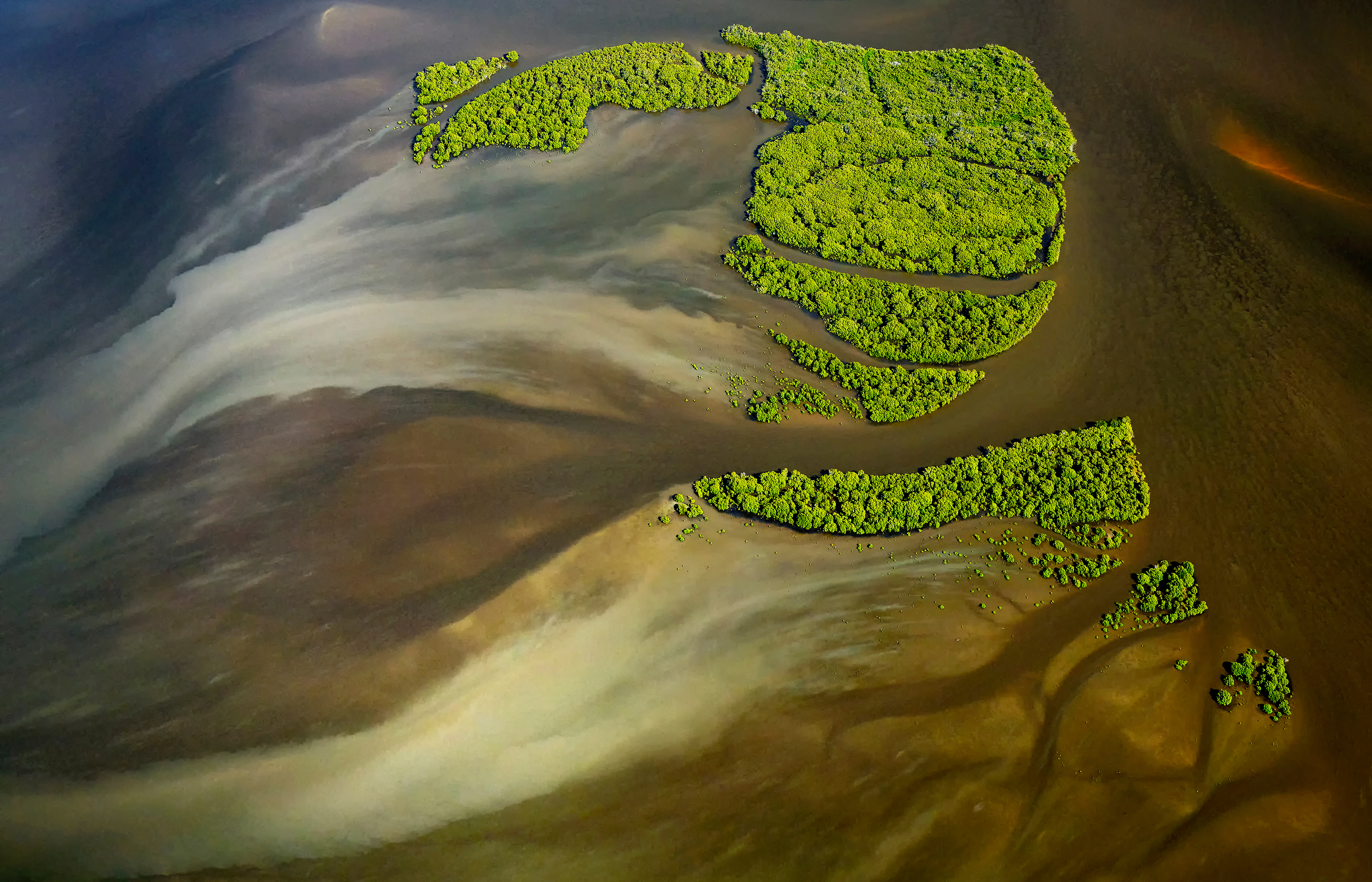 An aerial view taken from a helicopter of mangroves in an estuary at Yamba, New South Wales, Australia.