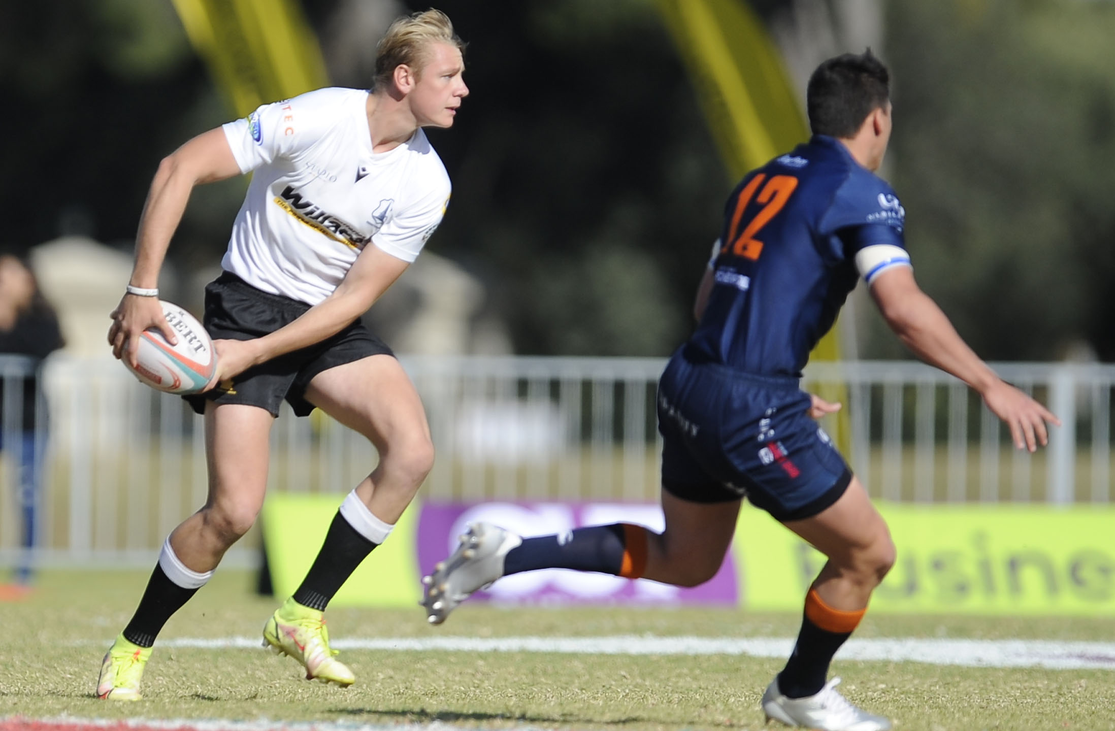 Conrad Sevenster of Hoërskool Monument passes the ball to an unseen player