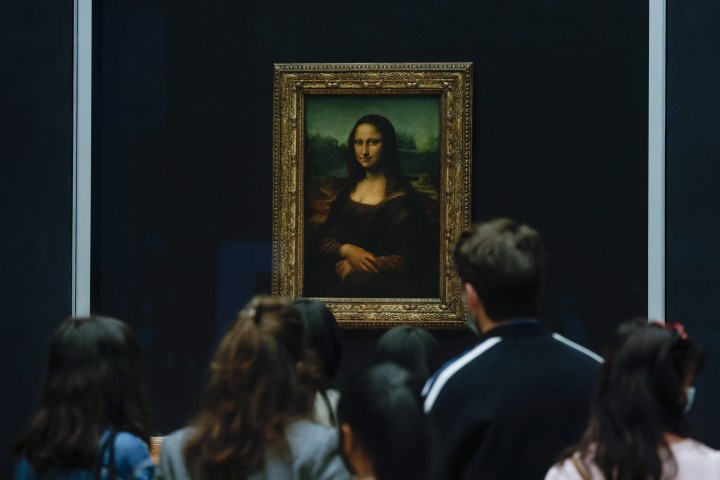 Mona Lisa left unharmed but smeared in cream in climate protest stunt