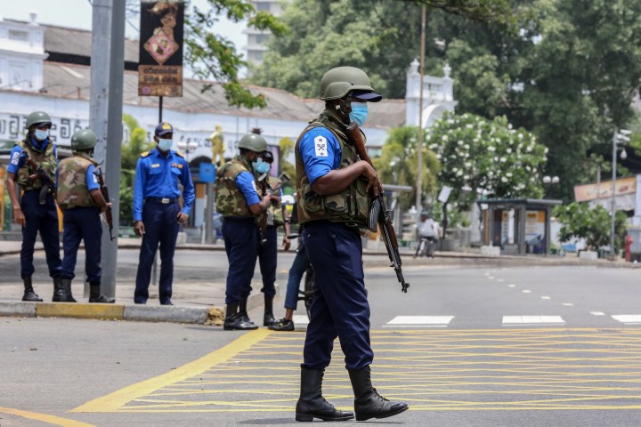 Sri Lanka whisks former PM to naval base as troops patrol streets