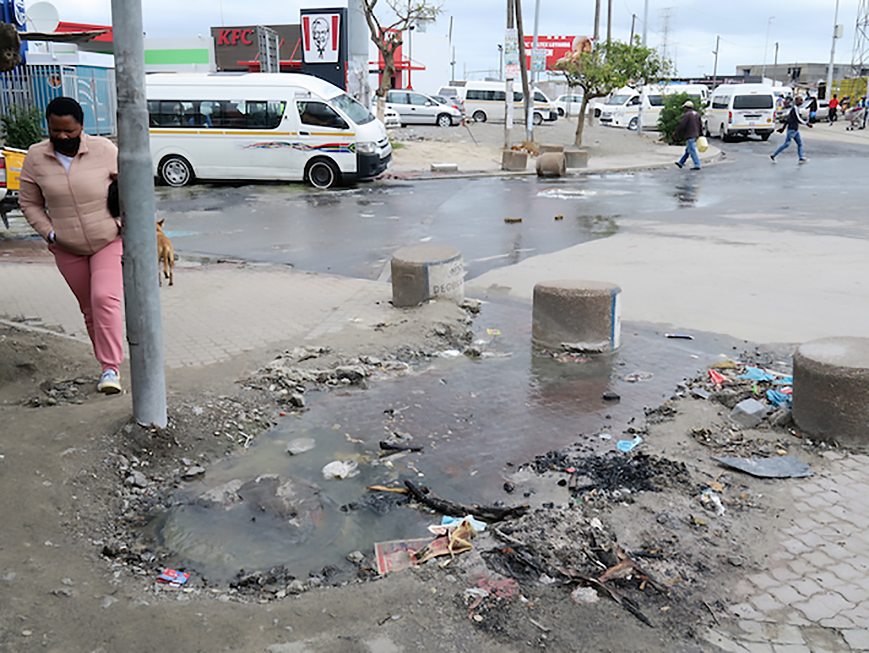 A street in Khayelitsha Site C with sewage overflowing from a manhole cover