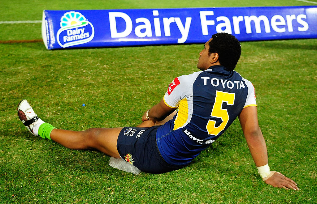 Kalifa Faifai Loa of the Cowboys sits with ice on his hamstring during the round 21 NRL match between the North Queensland Cowboys and the Penrith Panthers at Dairy Farmers Stadium 