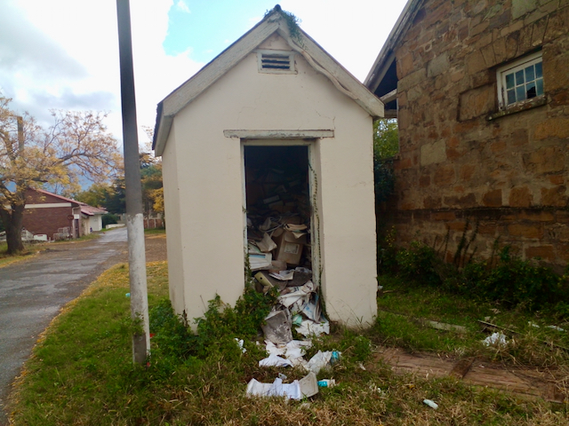 Patient files and other confidential paperwork lies dumped in a dilapidated guard hut on the grounds of Fort Beaufort Provincial Hospital 