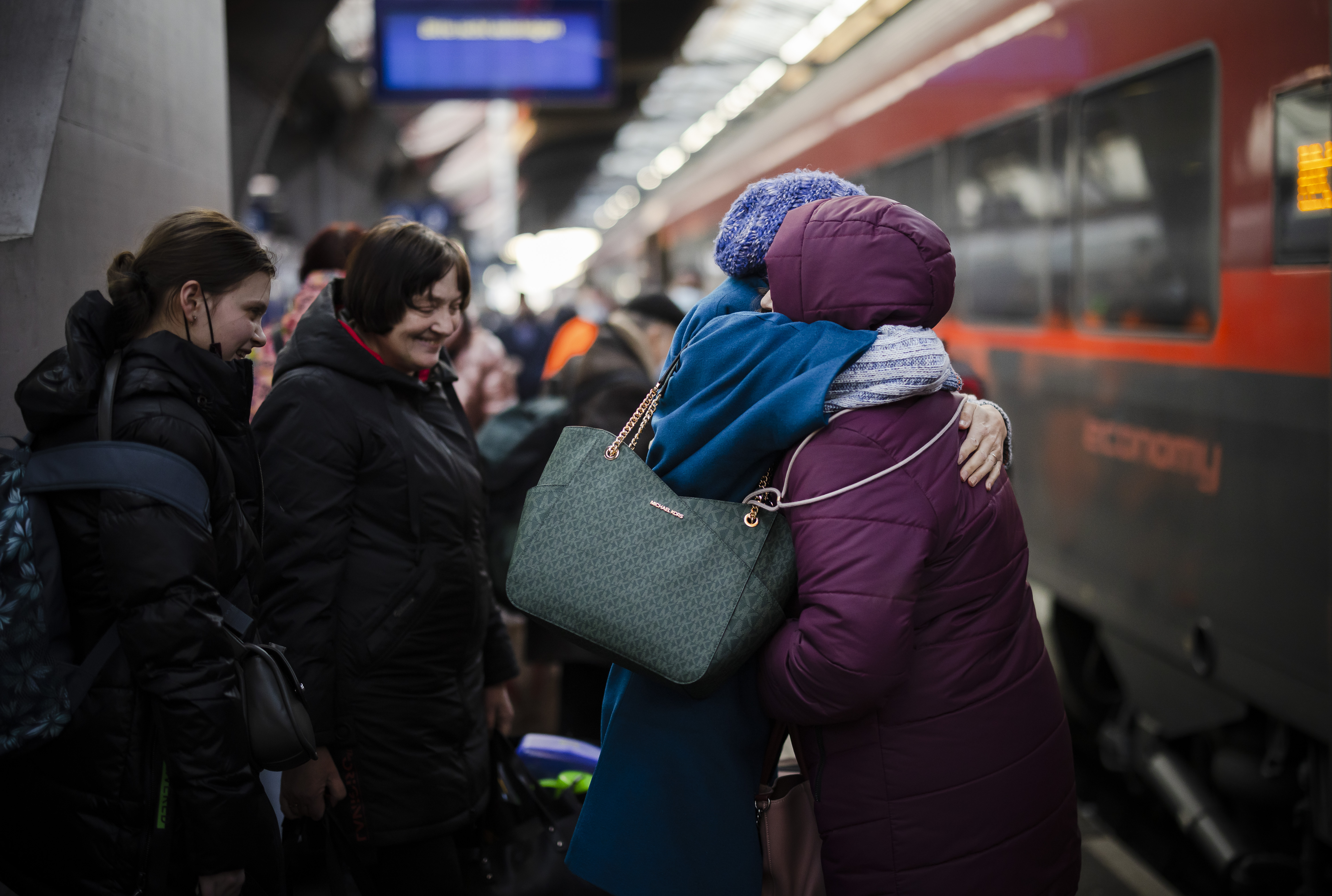 A woman from Ukraine reacts as she receives a hug after her arrival at Zurich's central station, following Russia's invasion of Ukraine, in Zurich, Switzerland, 09 March 2022. 