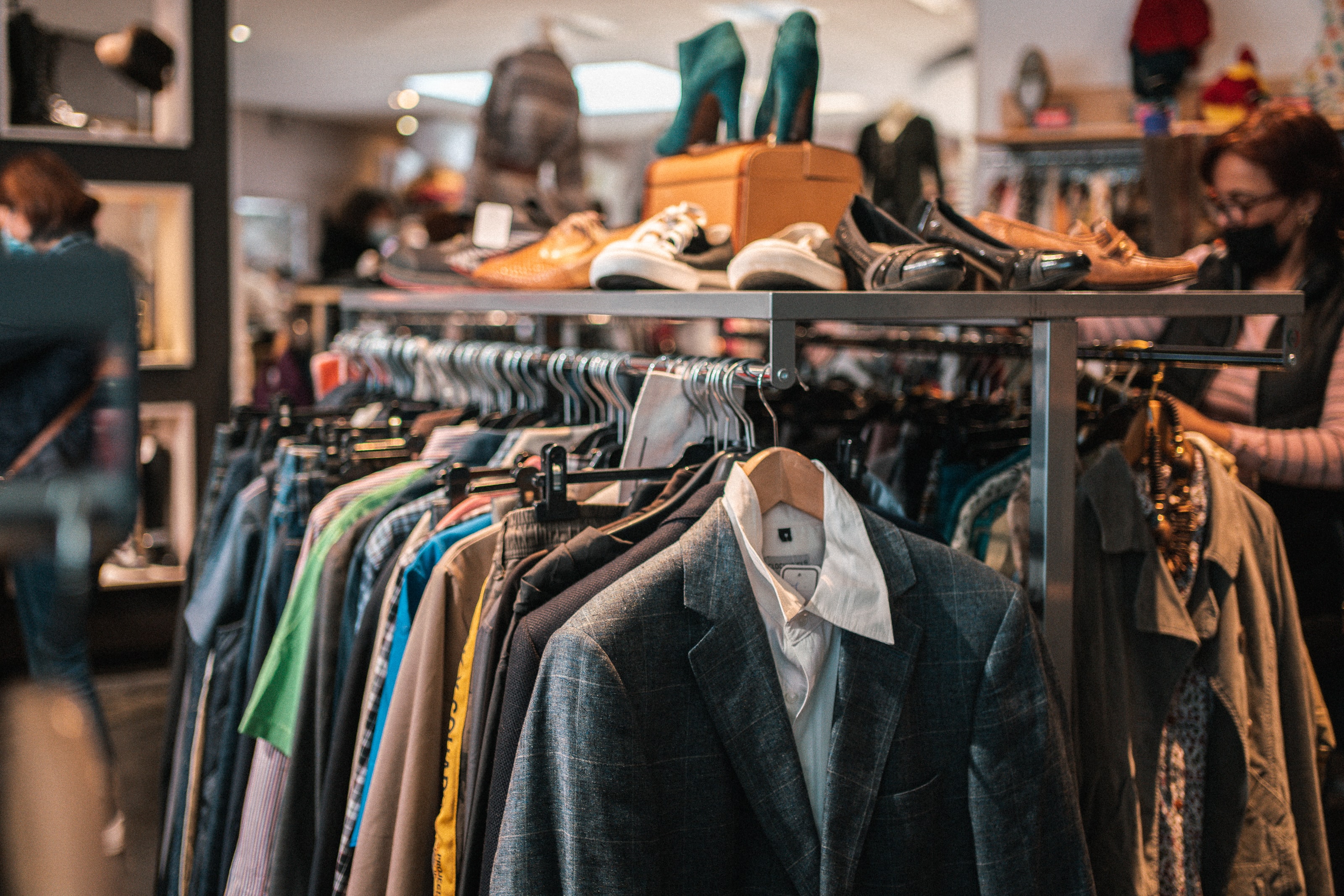Instead of buying new, support local thrift stores. Image: Hugo Clement / Unsplash