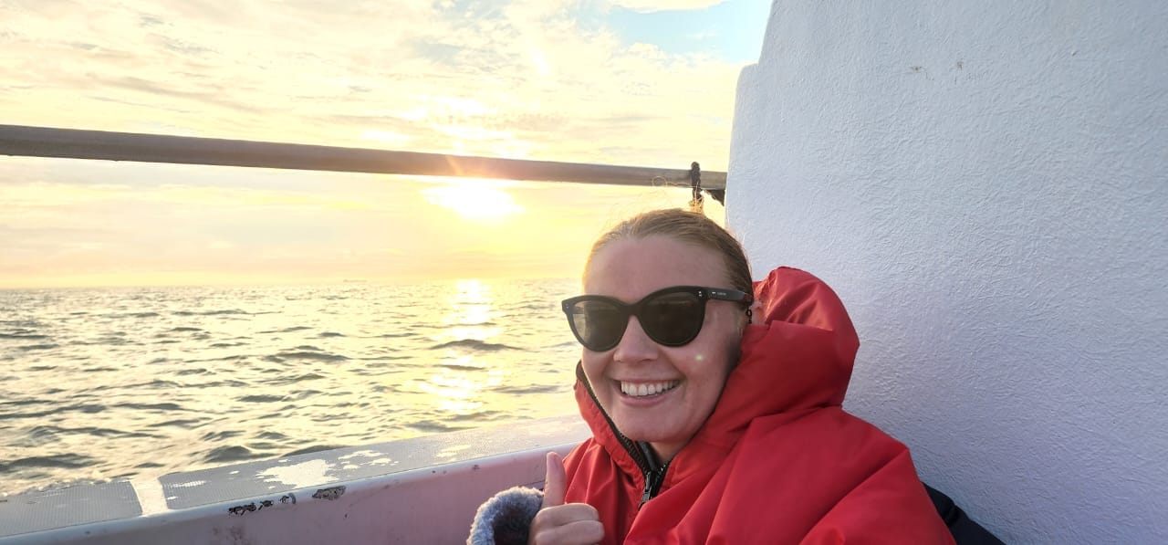 Michelle Weber takes in the sunset on the water. Image: Supplied