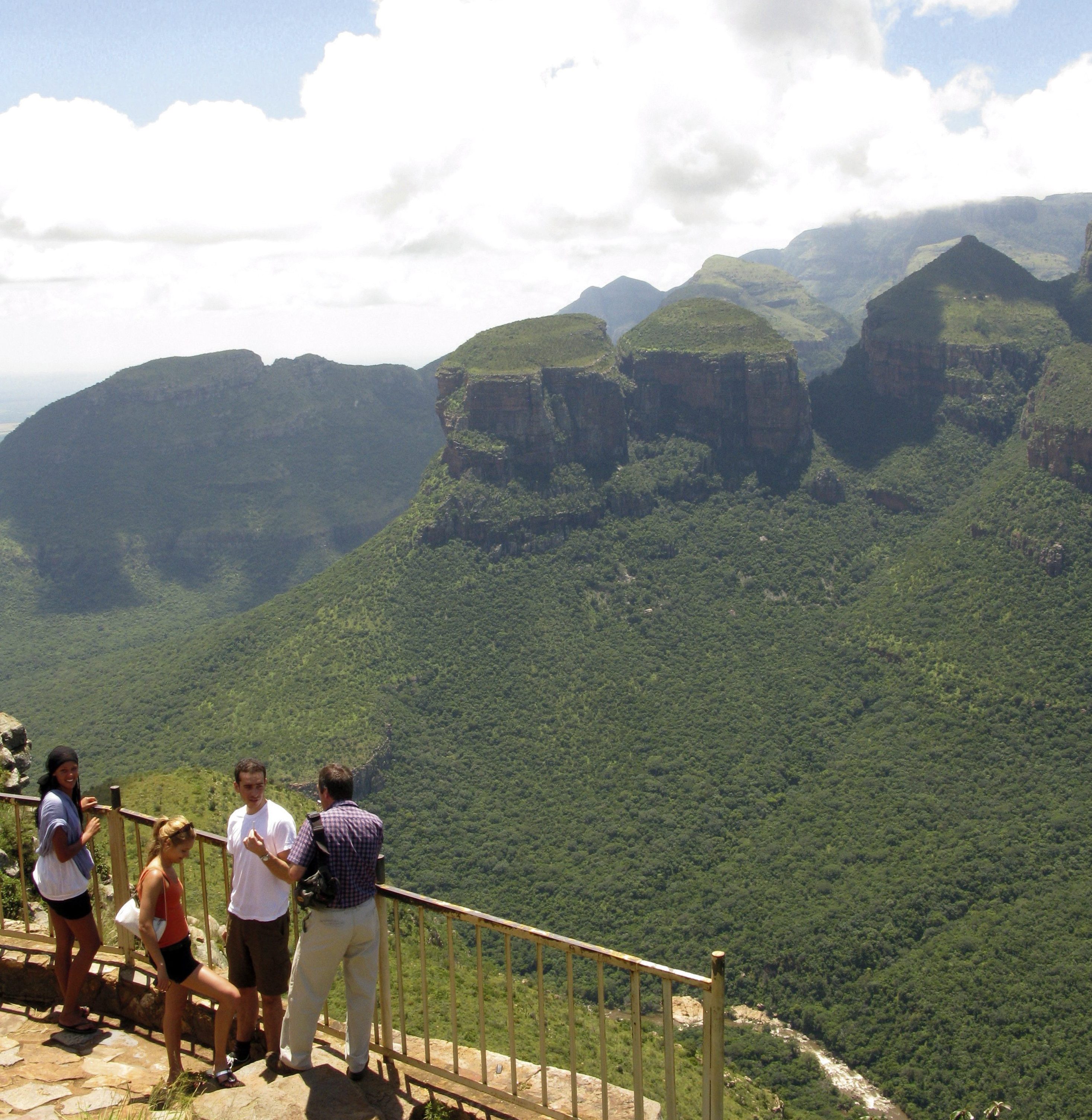 The Blyde and the Beautiful. If there were a Miss SA competition for dongas, the Blyde River Canyon would win it every year. The Three Rondavels with Mariepskop behind a group of tourist.