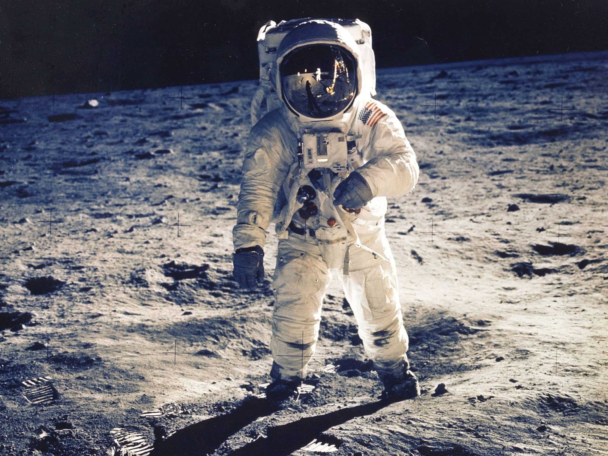 Astronaut Edwin E. Aldrin jr., lunar module pilot, is photographed walking near the lunar module during the Apollo 11 extravehicular activity. Man's first landing on the moon occurred at 4:17 p.m. July 20, 1969 as lunar module "Eagle" touched down gently on the sea of tranquility on the East side of the moon. 