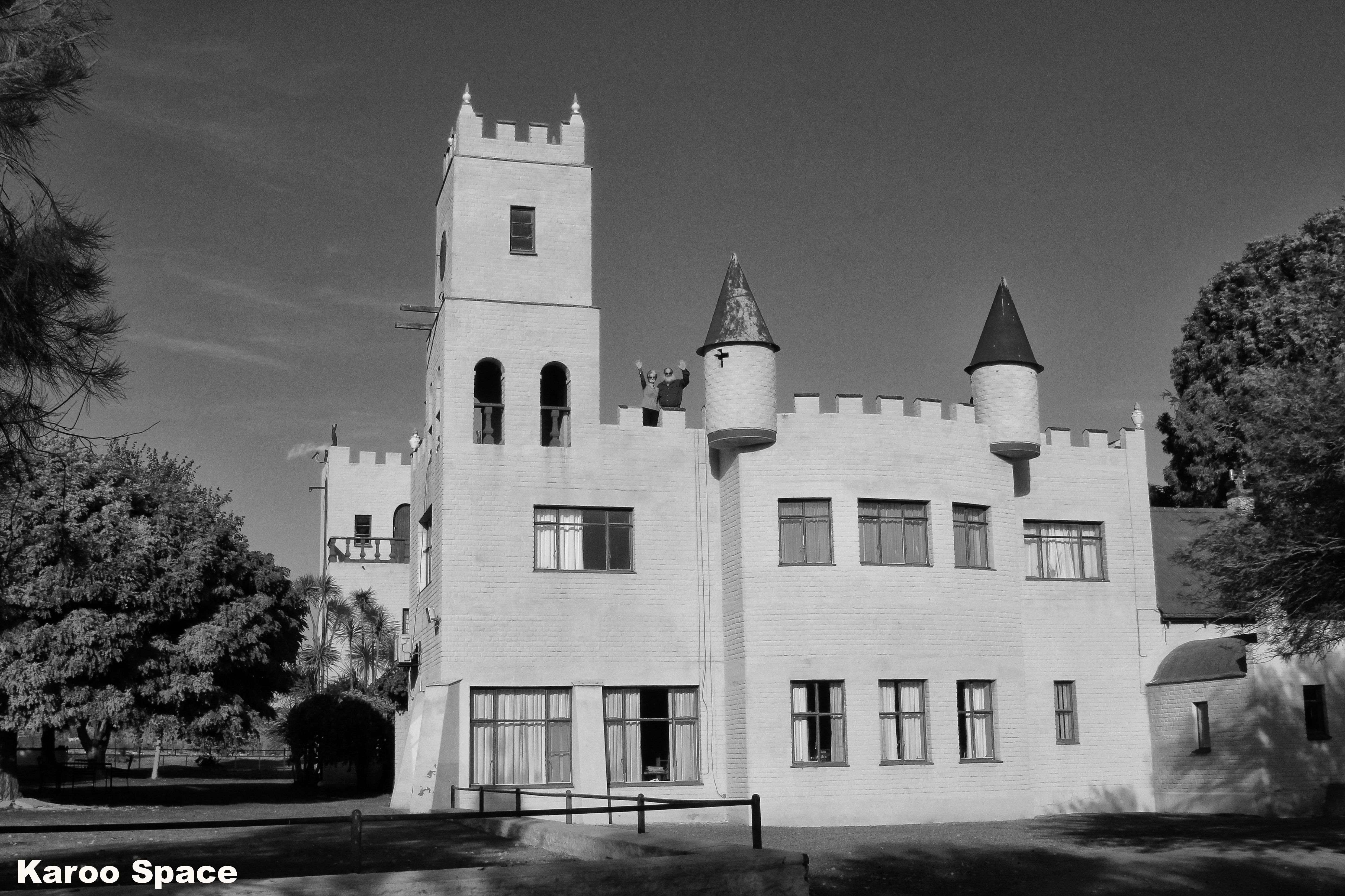 Dries and Myalan Wiese on the parapets of their Bavarian-style castle on Kasteel Farm outside Loxton, Northern Cape. Karoo Roads III Photo Essay