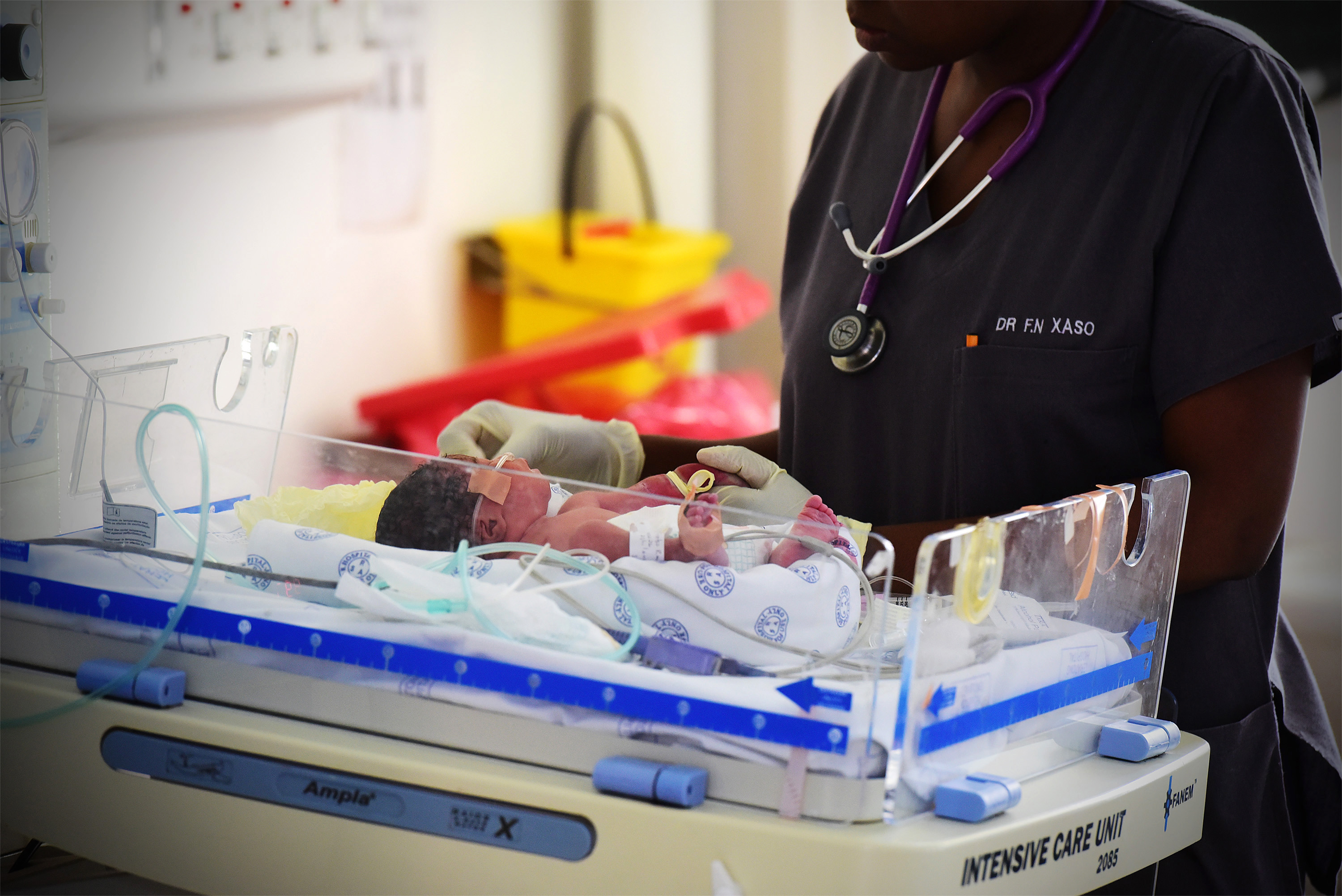 A newborn rests in an intensive care ward - healthcare services