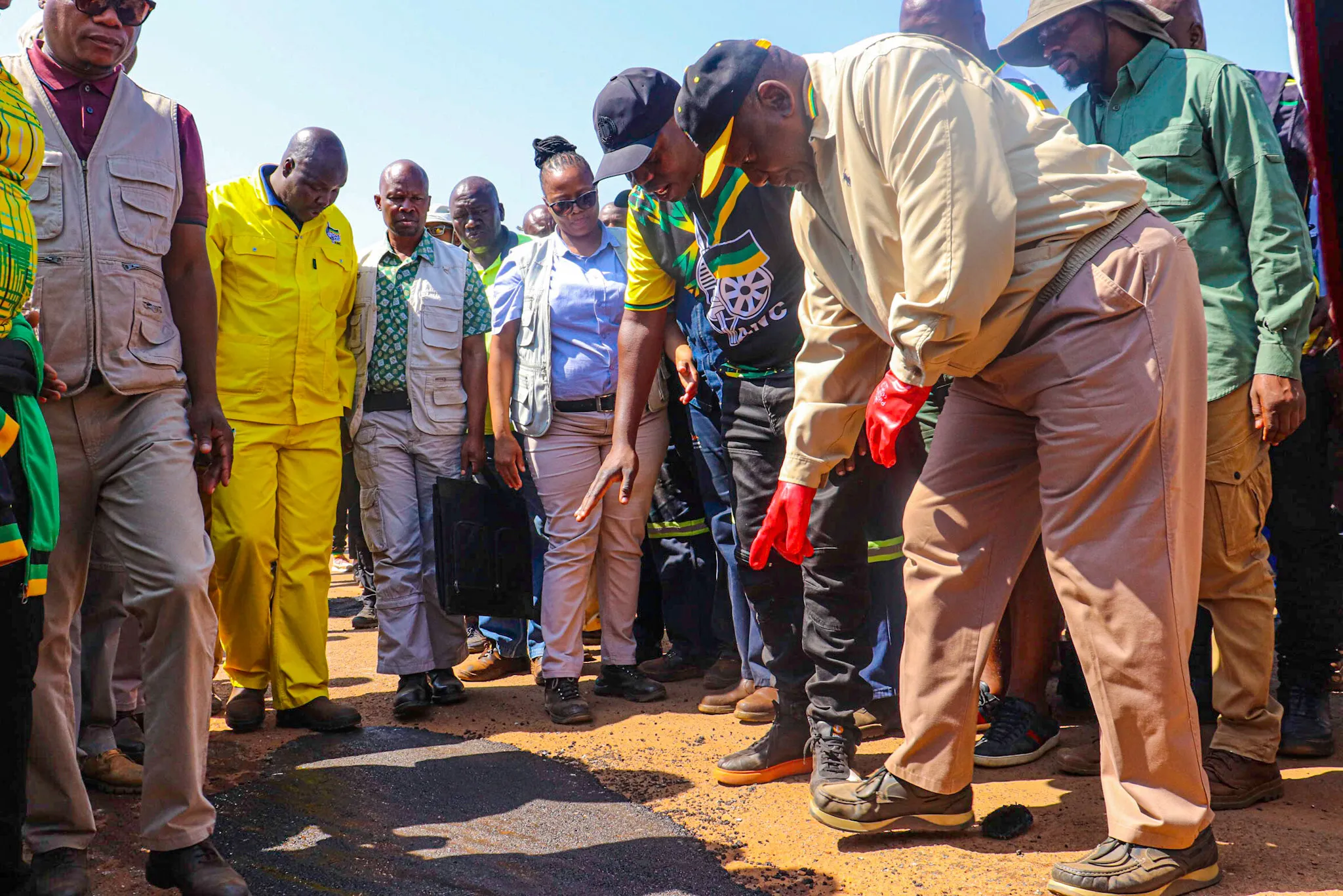 Cyril Ramaphosa inspect the one of many potholes he just fixed in Delmas Mpumalanga as part of the Letsema campaign. 