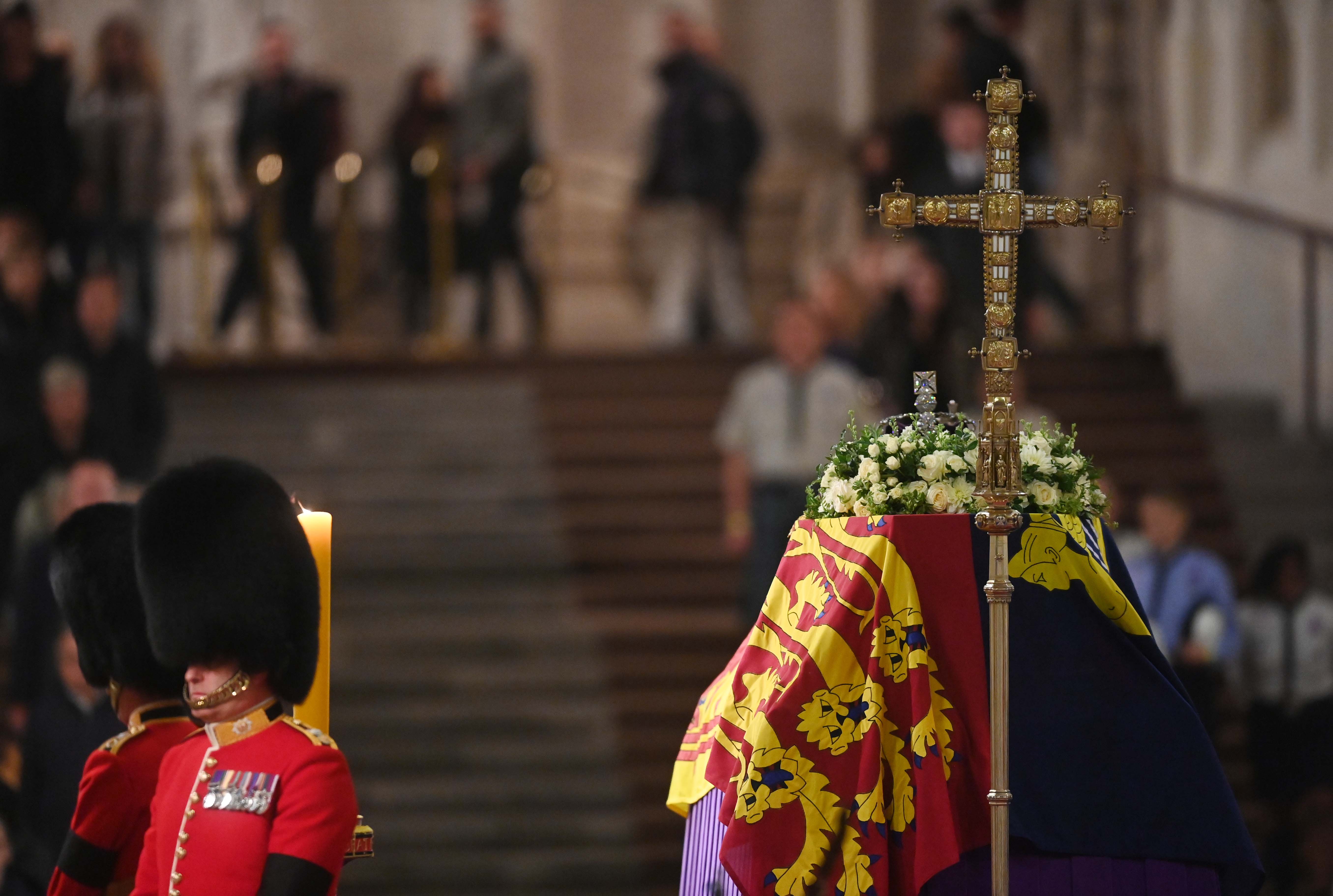 Members of the armed forces guard the coffin of Queen Elizabeth II