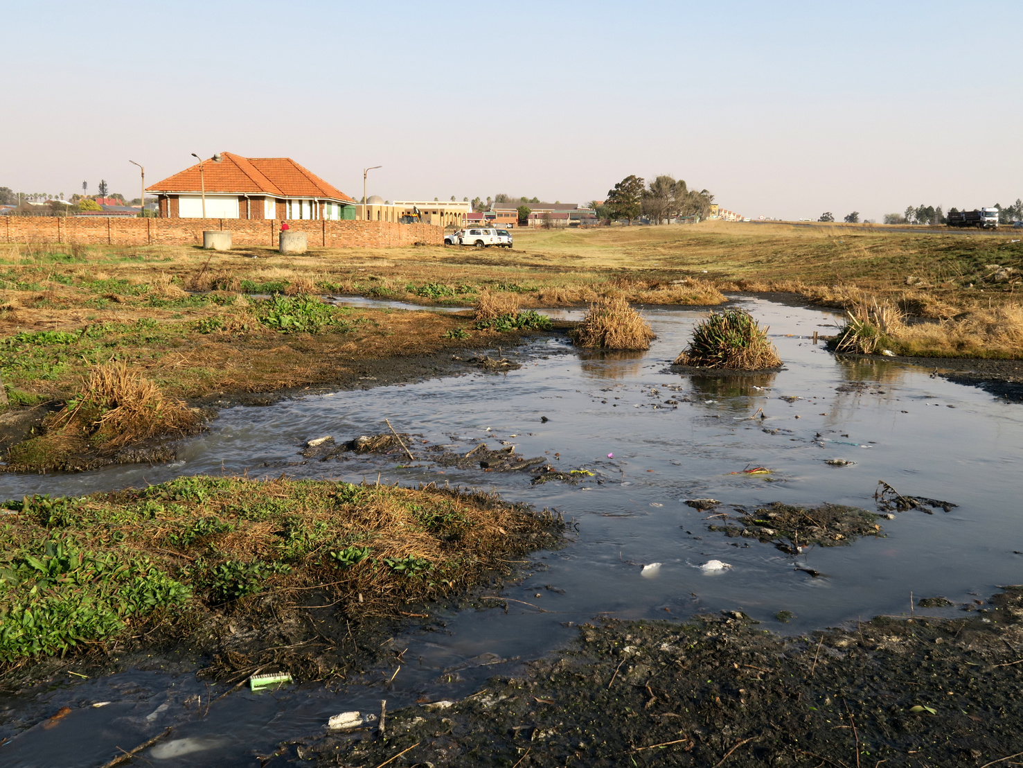 Vaal Dam - The stream of sewage flowing from a broken pump station in Evande