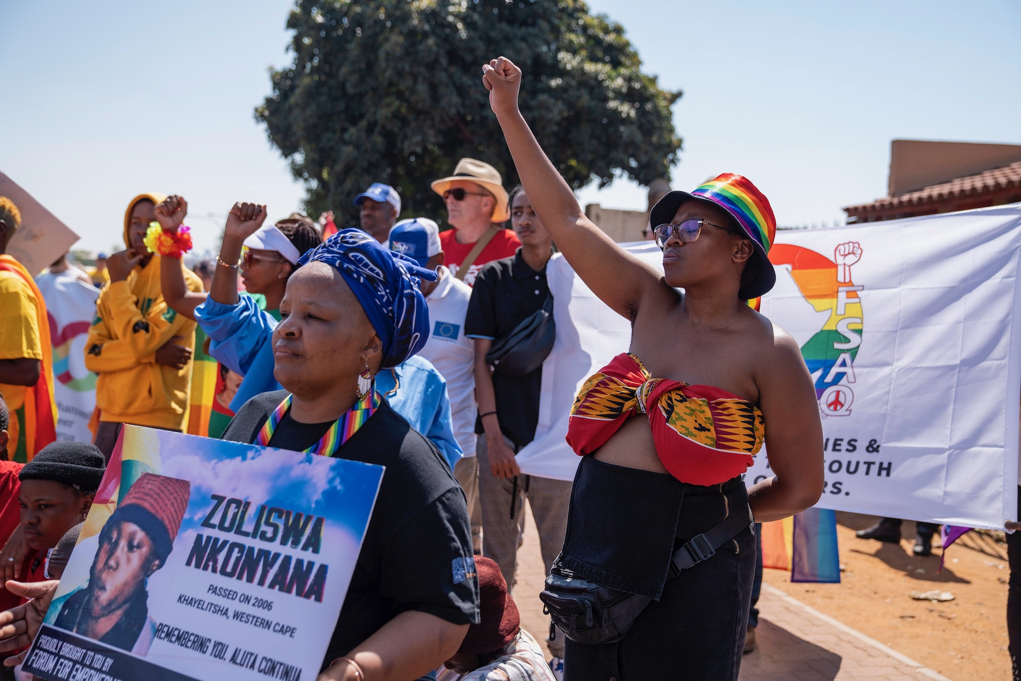 Marchers celebrating Soweto Pride pause outside Dobsonville police station