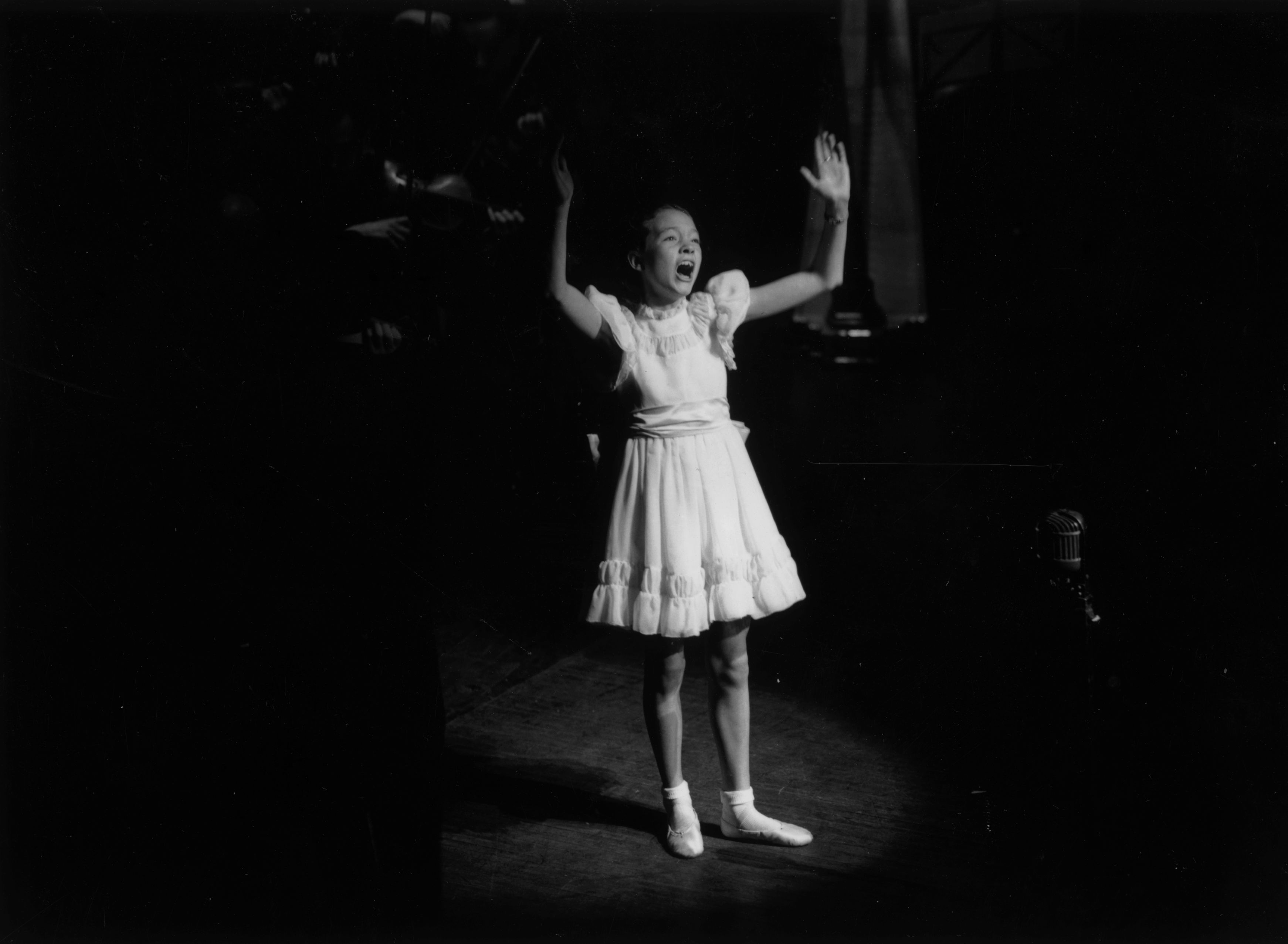 1st November 1948: Julie Andrews as a child singer, performing on stage at the Palladium during a Royal Command Performance. (Photo by Keystone/Hulton Archive/Getty Images)