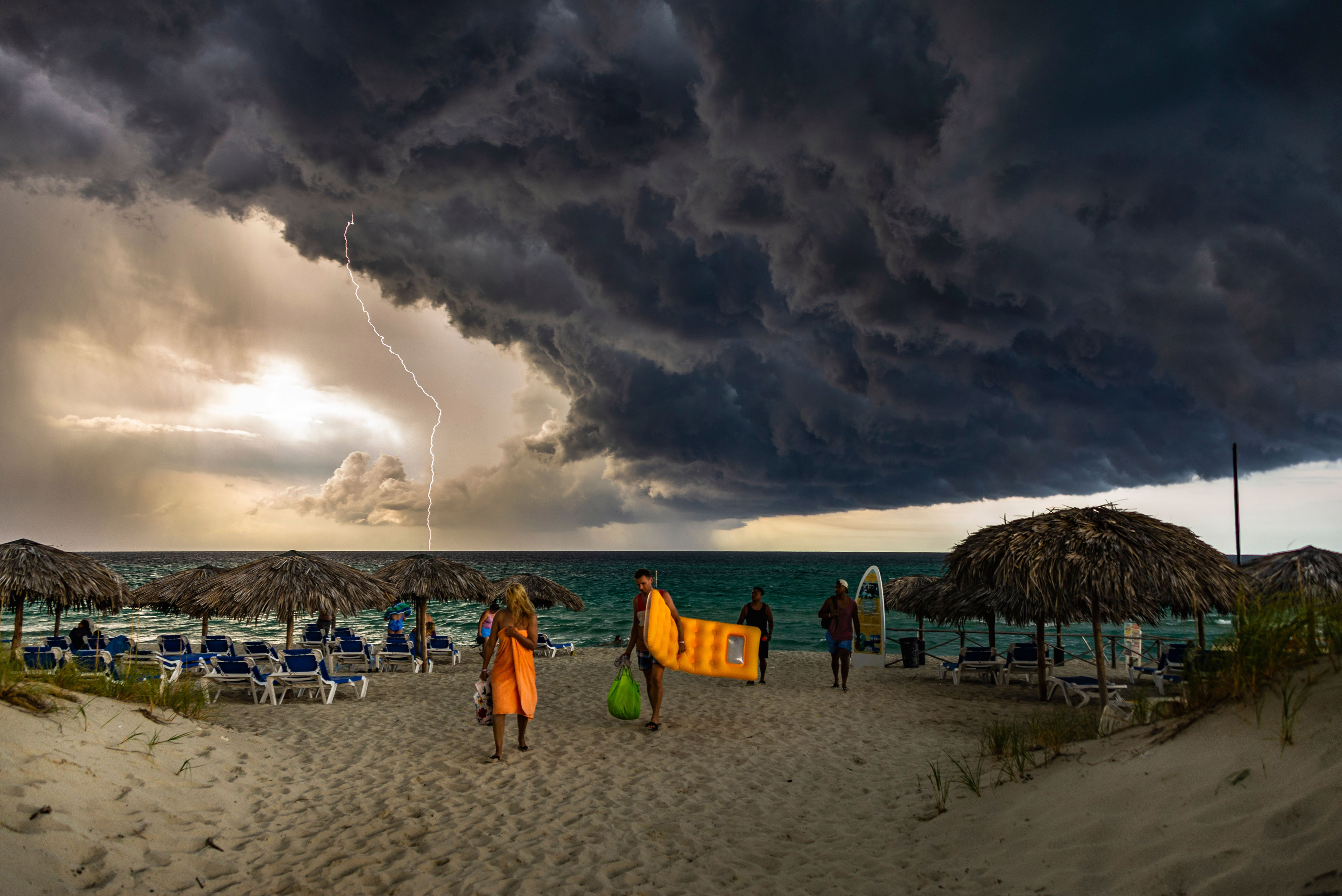 'The Storm is coming'. I was at Varadero beach, Cuba when I saw this huge cloud coming, then I ran to the room and brought my camera to capture it. With a lot of lightning I took some shots of this amazing storm. In the original photo I captured the exact moment when the lightning strikes the sea, without using long exposure features in daylight. That’s it! © Giovani Cordioli/TNC Photo Contest