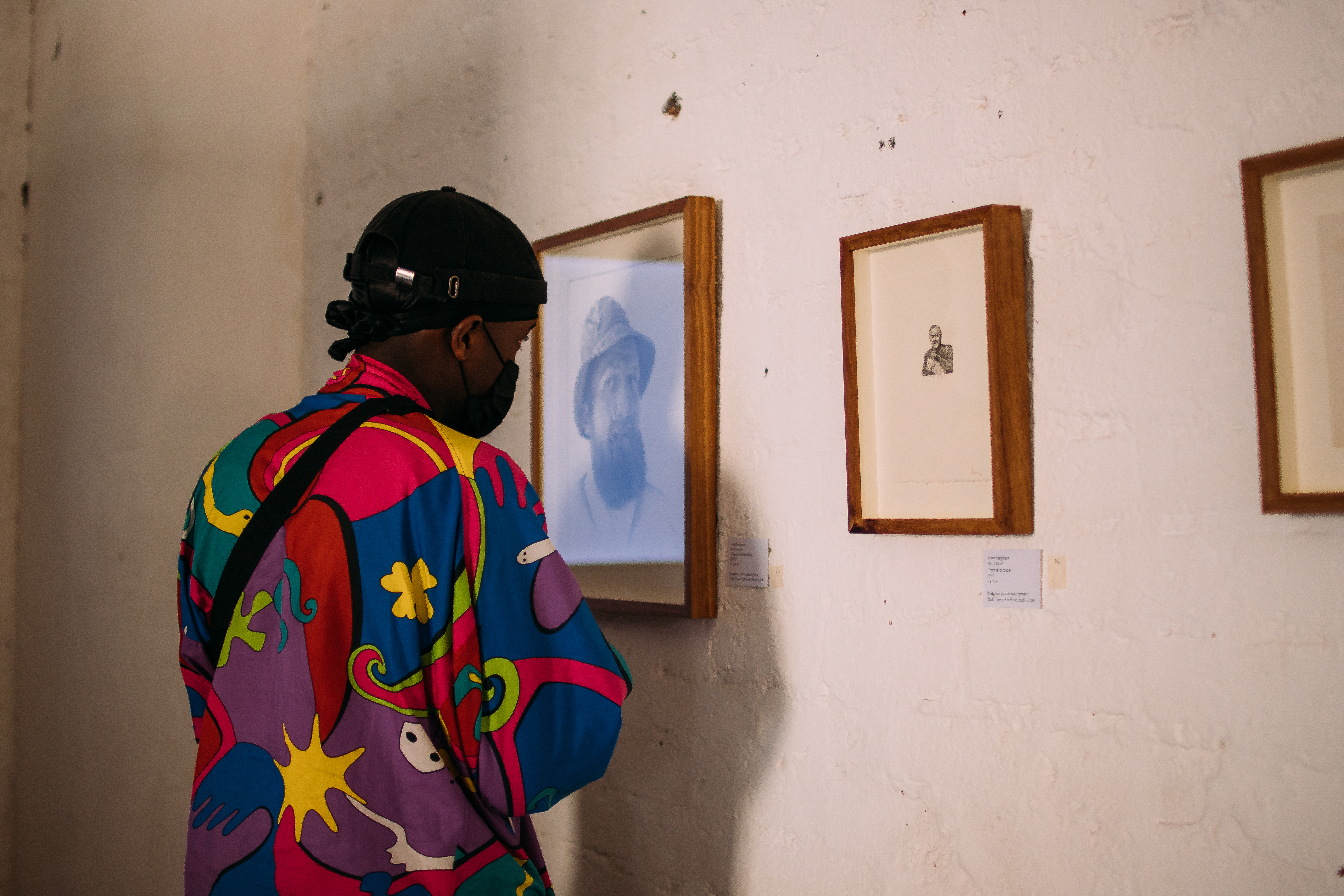 Visitor looking at Johan Stegmann’s artwork, as part of a group exhibition entitled “Broken Telephone”, curated by Olwethu de Vos. Image: Marc Hervé