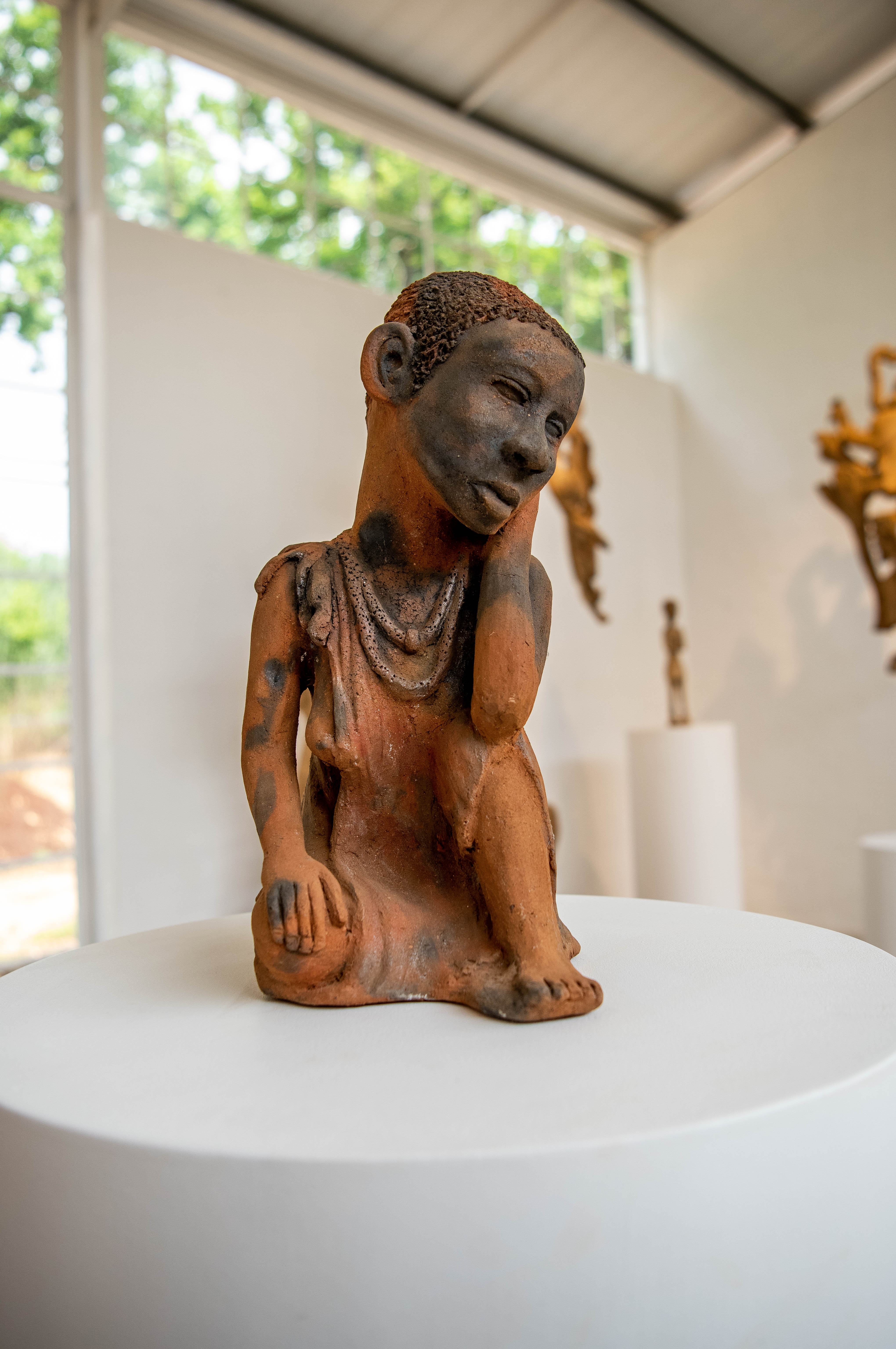 Installation view of 'Noria Mabasa_ Shaping Dreams,' 2022. Villa-Legodi Centre for Sculpture at NIROX Scuplture Park. Photo_ Lucky Lekalakala. Image courtesy of the artist, the Centre, and !KAURU Contemporary Art f