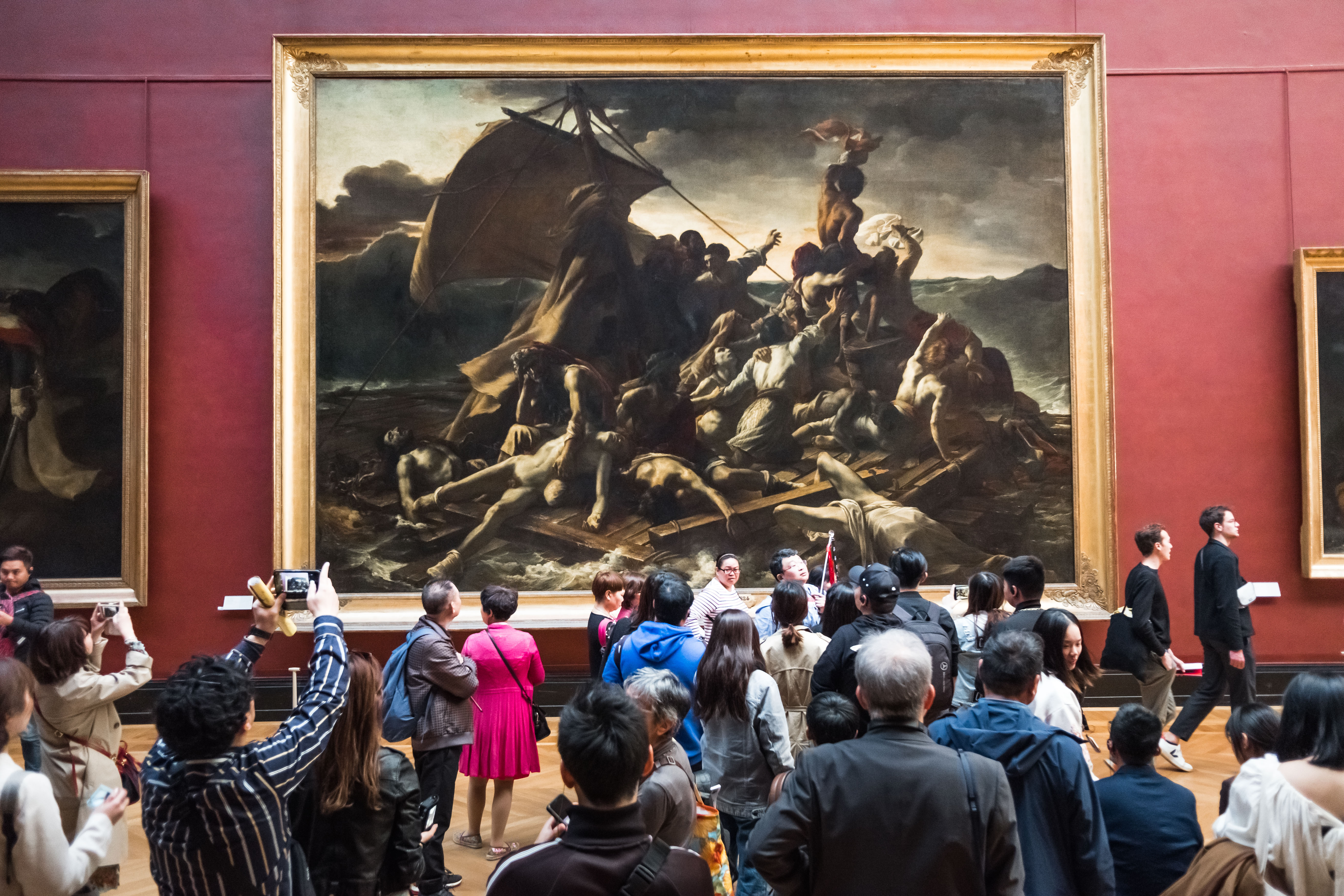 epa07564475 Tourists crowd and take picture in front of French artist Jean-Louis Andre Theodore Gericault's painting 'The Raft of the Medusa' at the French painting department of the Louvre Museum in Paris, France, 12 May 2019. EPA-EFE/CHRISTOPHE PETIT TESSON