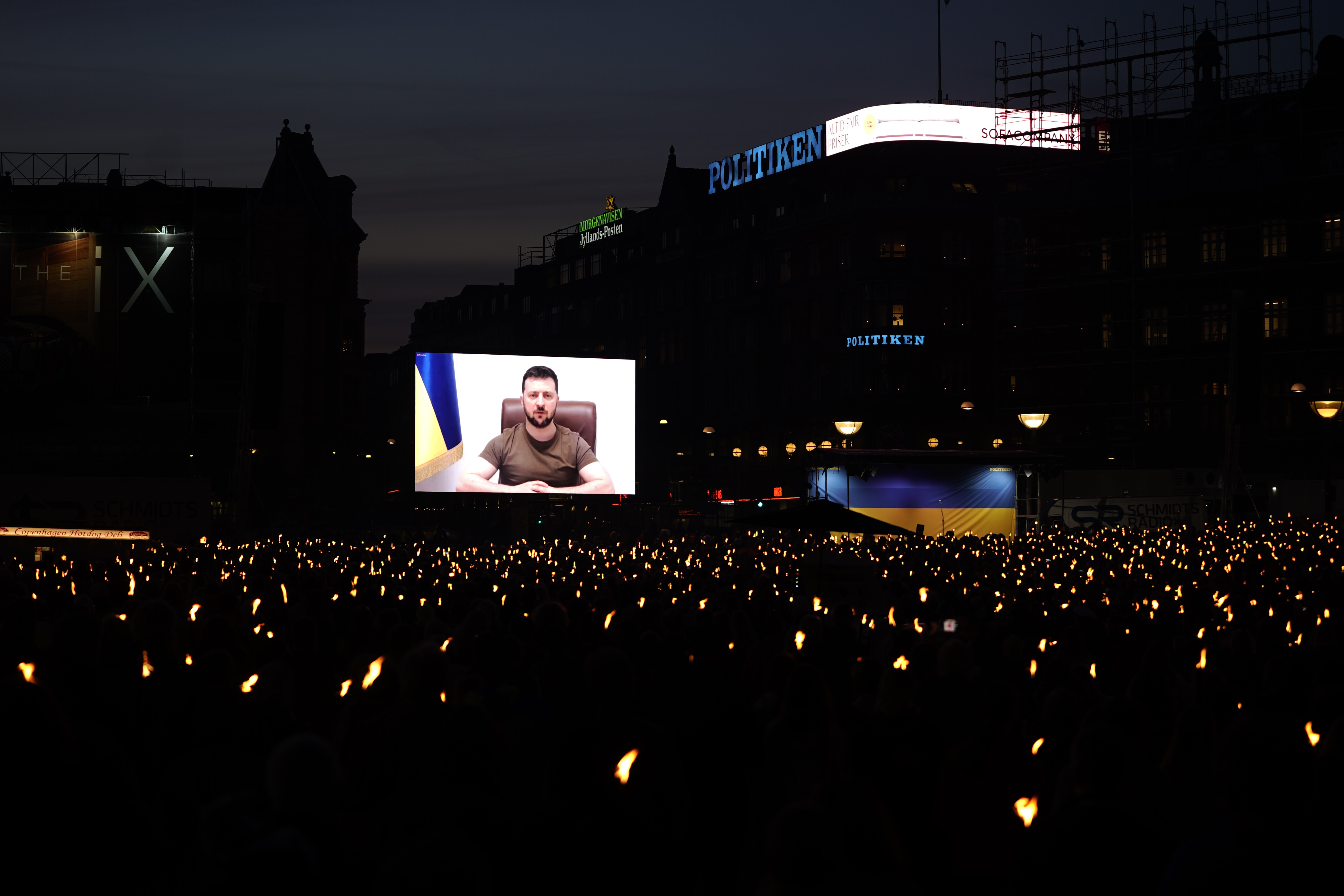 epa09927001 Ukranian President Volodymyr Zelensky appears on screen to address people at the City Hall Square in Copenhagen, Denmark, 04 May 2022. The event marking the 04 May anniversary of the Nordic country's liberation at the end of the Second World War, was organized by JP/Politiken Media Group. EPA-EFE/LISELOTTE SABROE DENMARK OUT