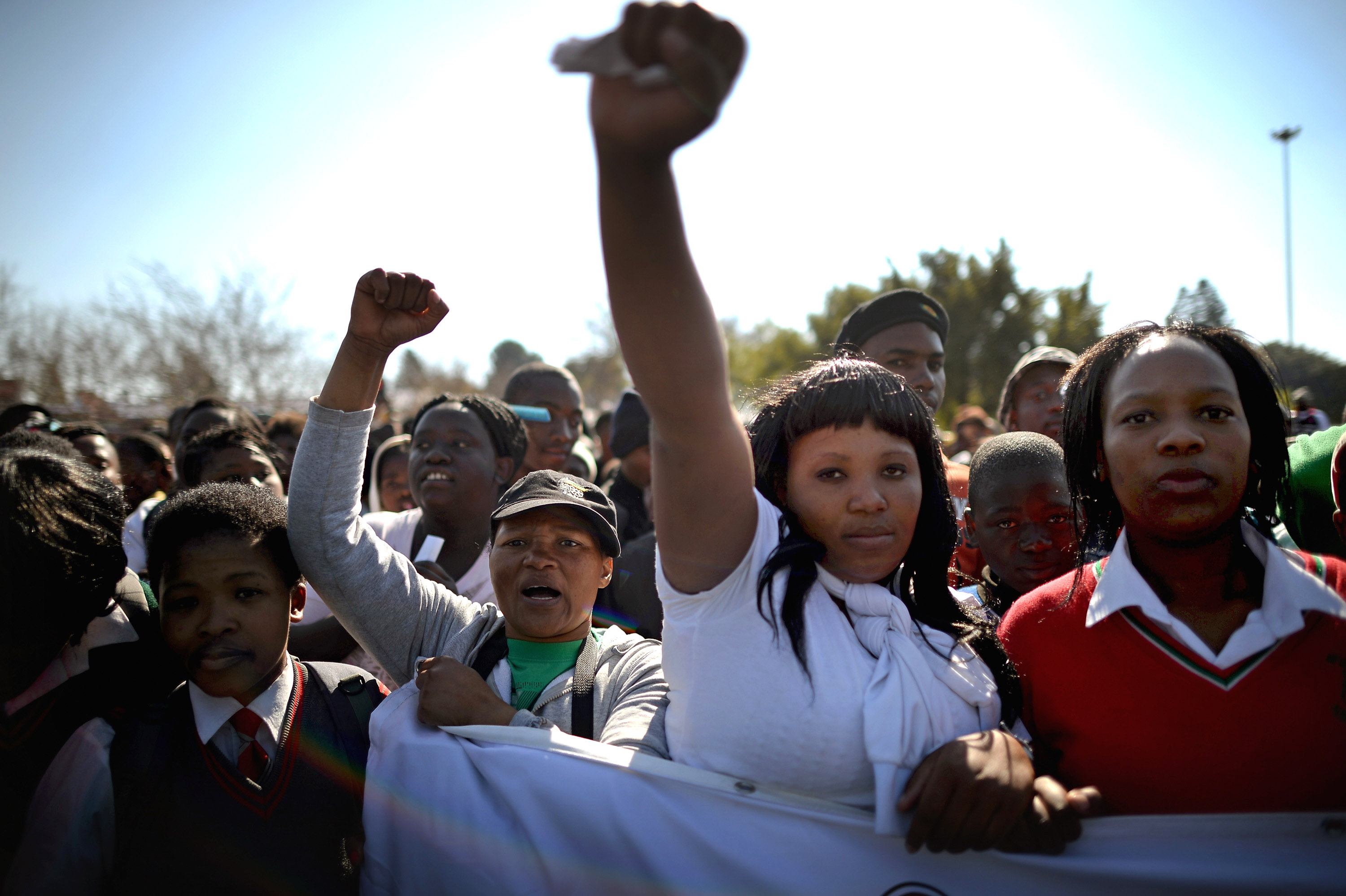 Young people participate in a march to commemorate Youth Day in Soweto Township on June 16, 2013 in Johannesburg, South Africa. Youth Day commemorates the Soweto Uprising of June 16, 1976, when students gathered on the streets of Soweto to protest against Afrikaans being the language of instruction used in schools. The protest turned violent, resulting in the deaths of students and hundreds others in the riots that followed across South Africa.  (Photo by Jeff J Mitchell/Getty Images)