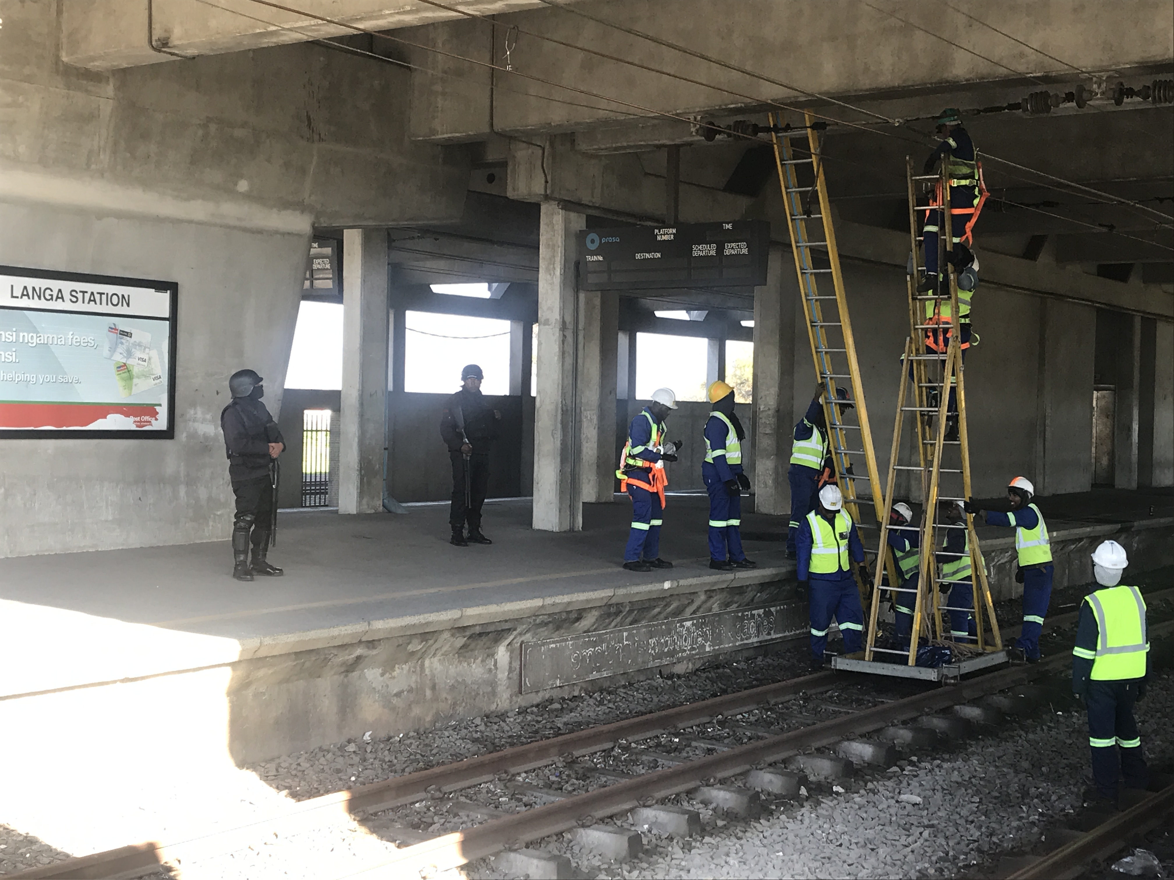 Railway workers attend to overhead cables at Langa Station. Khayelitsha 