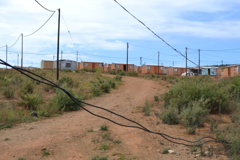 Illegal electricity connection tensions mount between families in shacks and government housing in Kariega