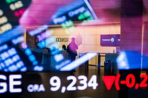 Stock price information displayed in the lobby of the Euronext NV stock exchange in Paris, France, on Wednesday, 14 December 2022. (Photo: Nathan Laine/Bloomberg)
