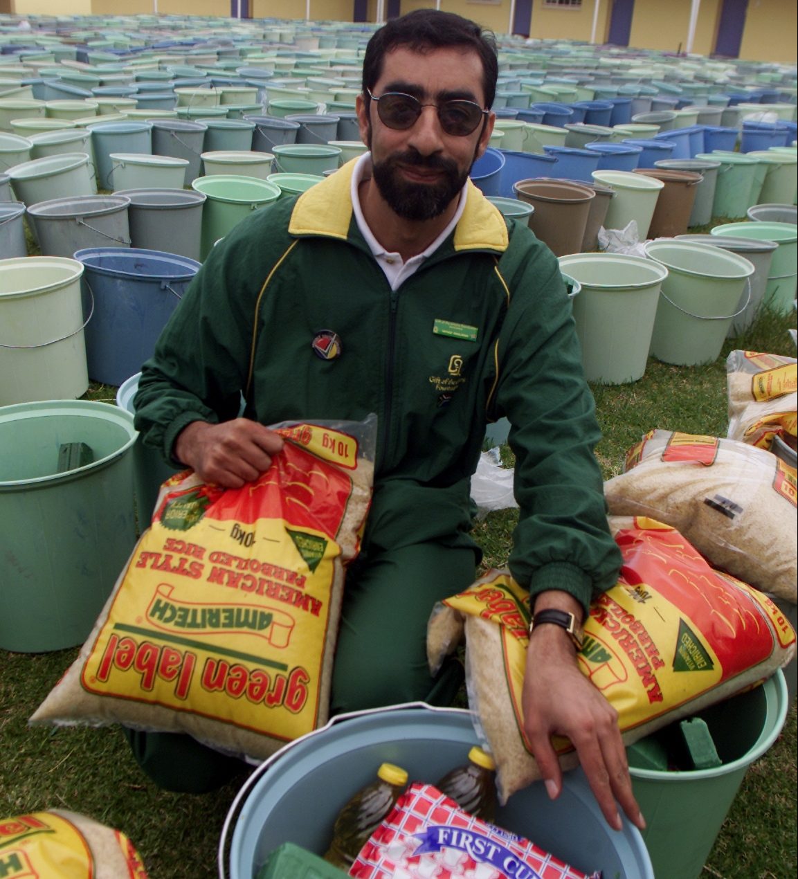JOHANNESBURG, SOUTH AFRICA: Dr. Imtiaz Sooliman, Founder of Gift of the Givers foundation with a food hamper for the Poverty Alleviation Feast at Tabankulu in the starving and malnurished Eastern Cape on 29 November 2002. (Photo by Gallo Images / Sunday Times / Richard Shorey)