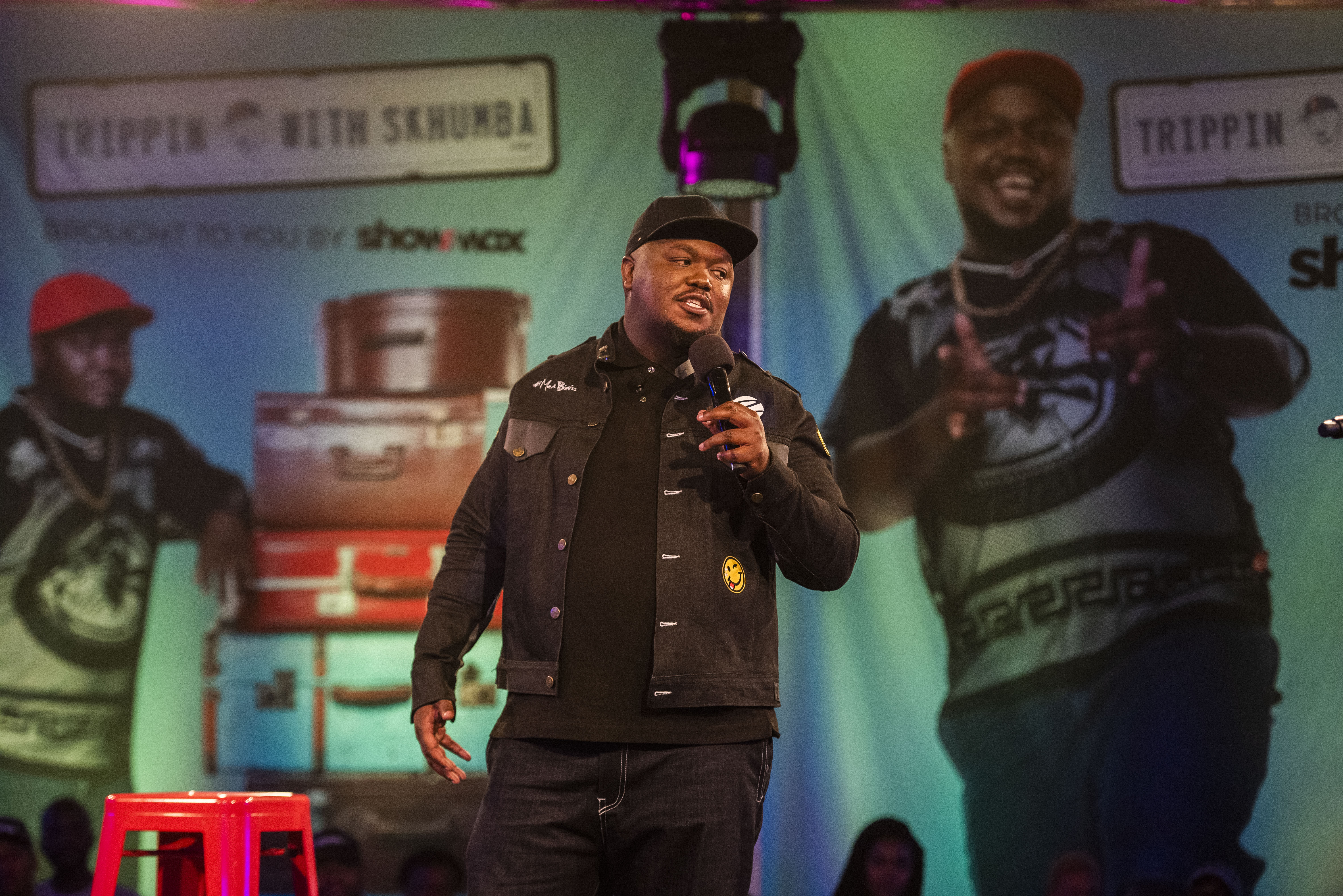 JOHANNESBURG, SOUTH AFRICA – MARCH 23, 2019: Skhumba Hlophe perform ath the launch of the new local Showmax Original show Trippin with Skhumba held on Saturday 23 March 2019 at 1 Fox Street. The show is taking Skhumba around the country visiting the hometowns of his comedian friends Mashabela Galane, Celeste Ntuli, Tumi Morake, Salesman, Siya Seya and Schalk Bezuidenhout. Along the way they engage with up-and-coming comics from each of the comedians’ hometowns. These rising stars got to share the stage for the first time with their mentors at this event. Photo by Gallo Images / Alet Pretorius)
