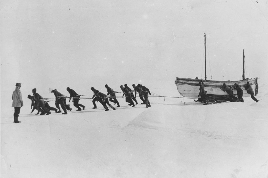 ANTARCTICA - 1916: Members of an expedition team led by Irish explorer Sir Ernest Henry Shackleton pull one of their lifeboats across the snow in the Antarctic, following the loss of the 'Endurance'. (Photo by Hulton Archive/Getty Images)