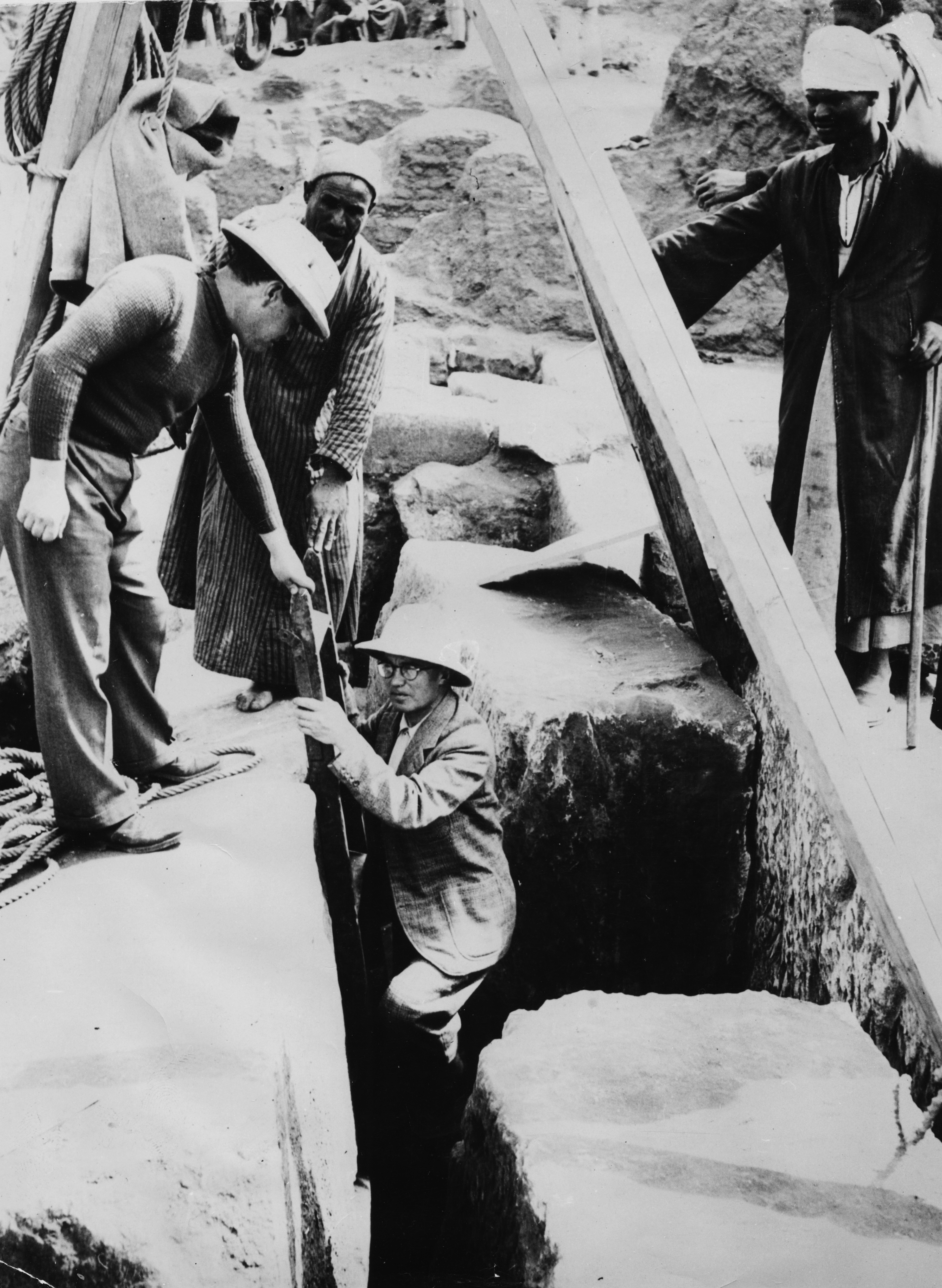 French Egyptologist Pierre Montet walking down a step ladder into the newly discovered tomb of Pharaoh Tutankhamun, circa 1923. (Photo by Keystone/Hulton Archive/Getty Images)