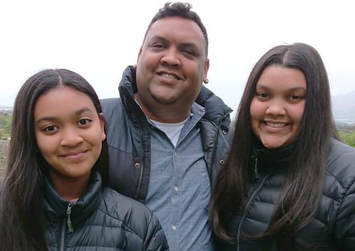 Kirsten on the right of her father; her sister Jenna stands on the left. Image: Kirsten Pillay / Supplied