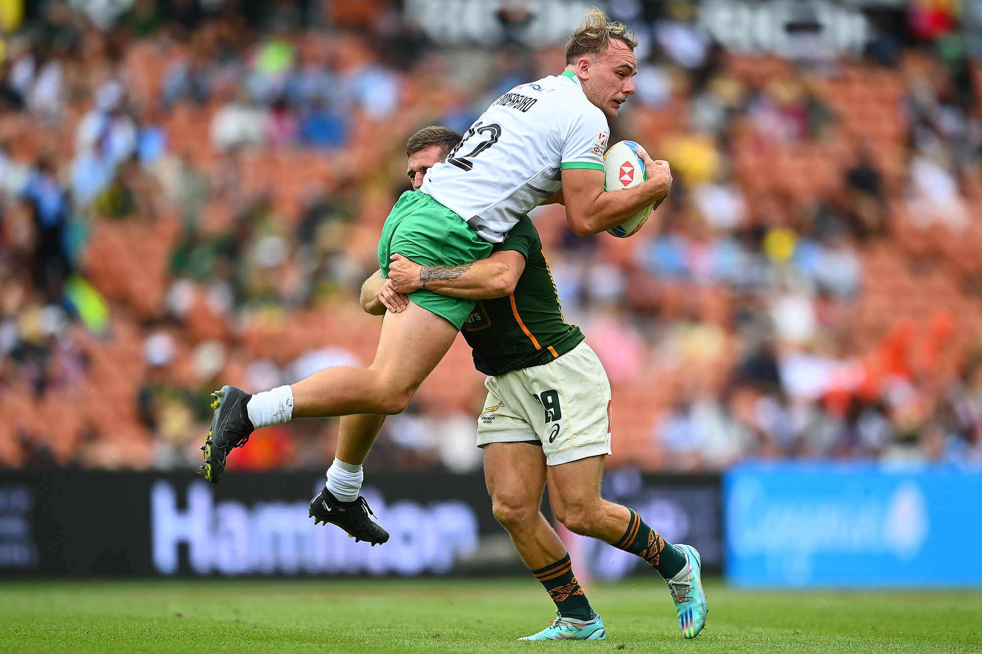 Niall Comerford of Ireland is tackled by Ricardo Duarttee, New Zealand