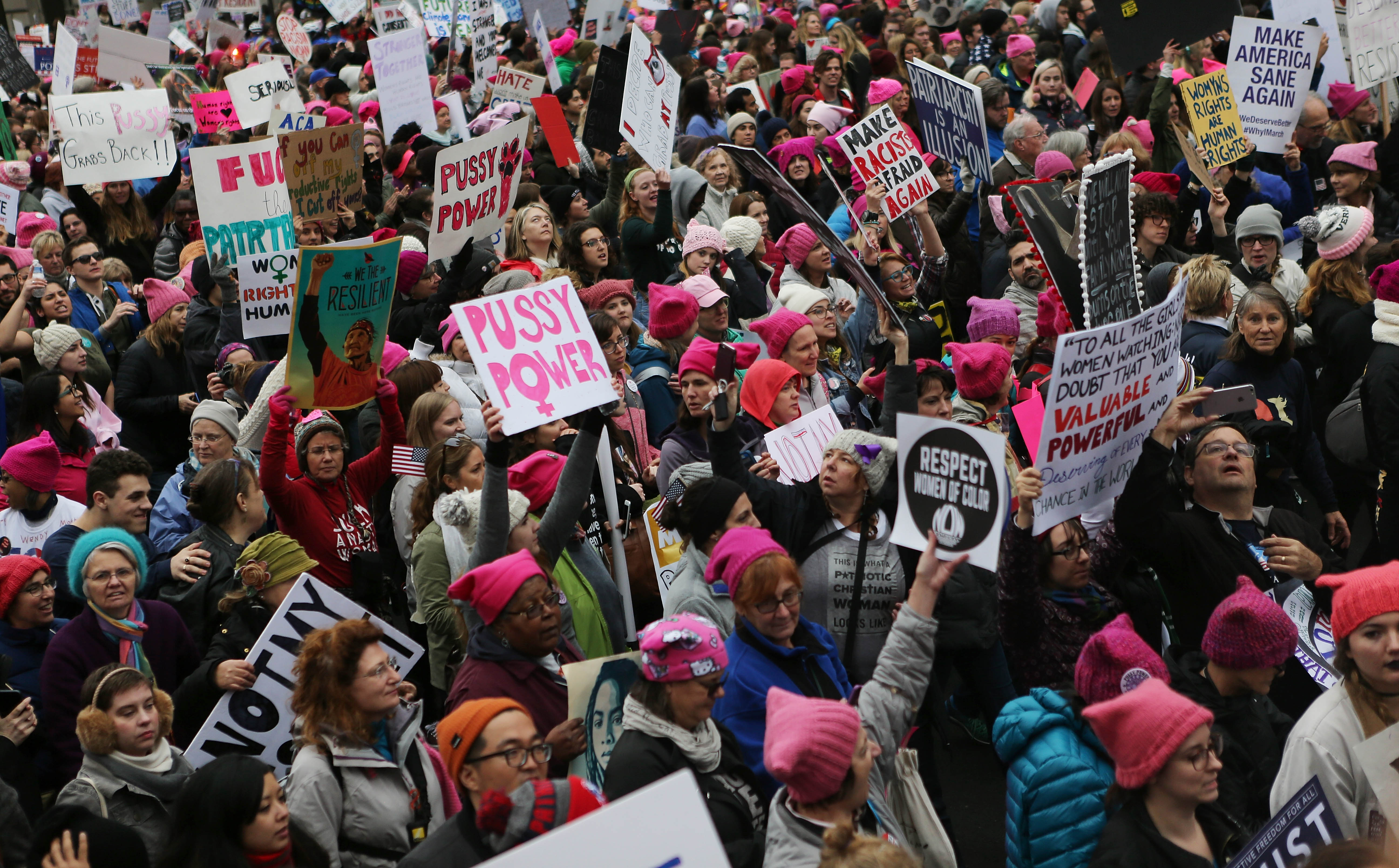 WASHINGTON, DC - JANUARY 21: Protesters march during the Women's March on Washington on January 21, 2017 in Washington, DC. Large crowds are attending the anti-Trump rally a day after U.S. President Donald Trump was sworn in as the 45th U.S. president. (Photo by Mario Tama/Getty Images)