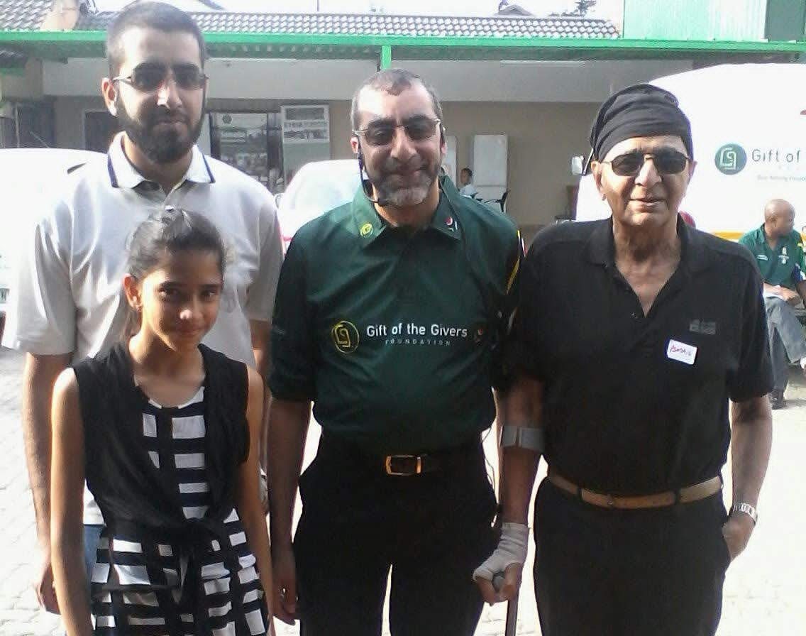 Imtiaz Sooliman and his son Muhammad Rayhaan, his niece Tasmiyya, his father, Ismail Sooliman, at Gift of the Givers Logistics Centre in Bramley, Johannesburg, around 2015. Image: Supplied by Imtiaz Sooliman