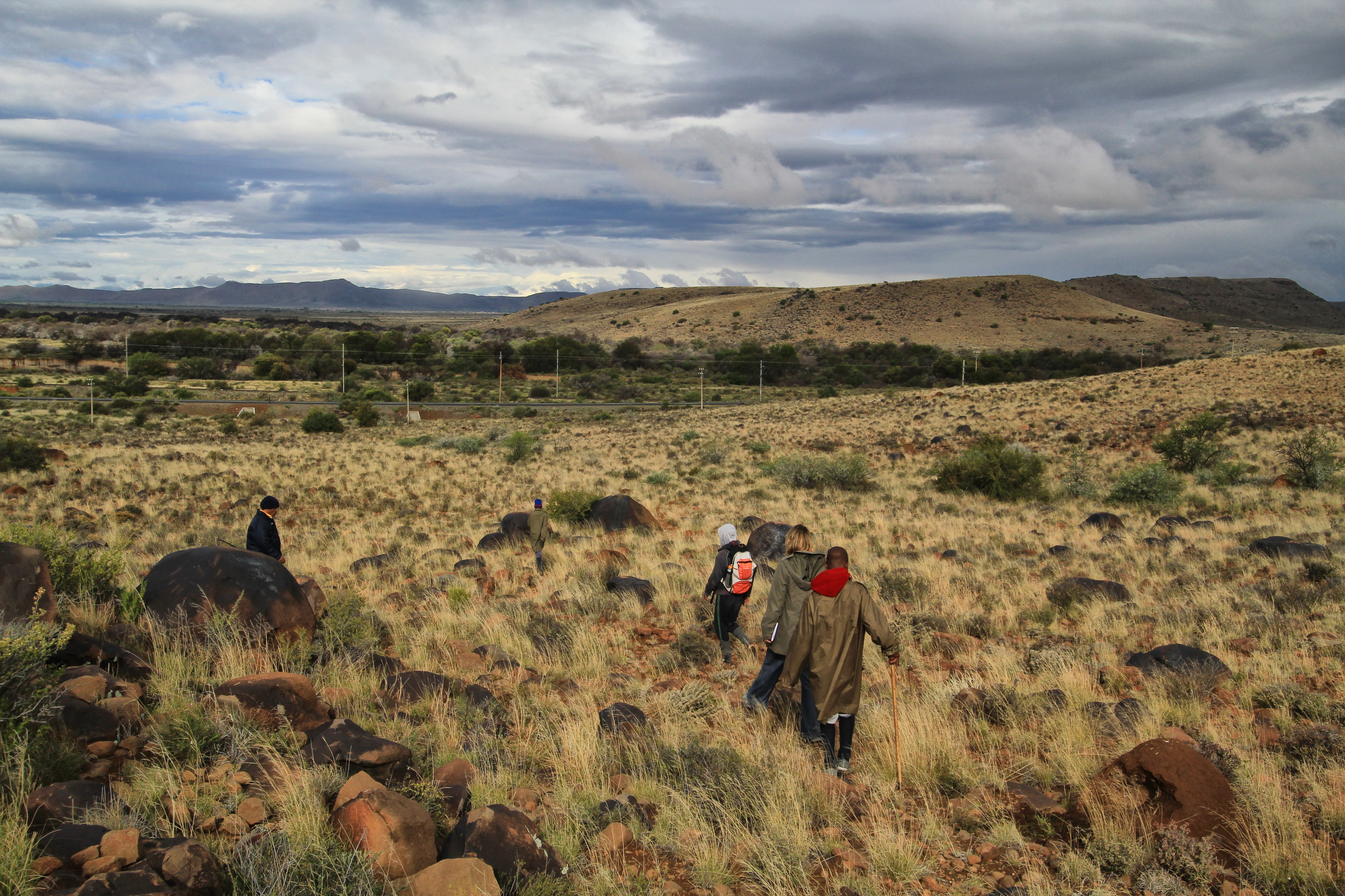 Laurence Rathenam and his charges take the author on a veld walk to see the rock engravings. Image: Chris Marais