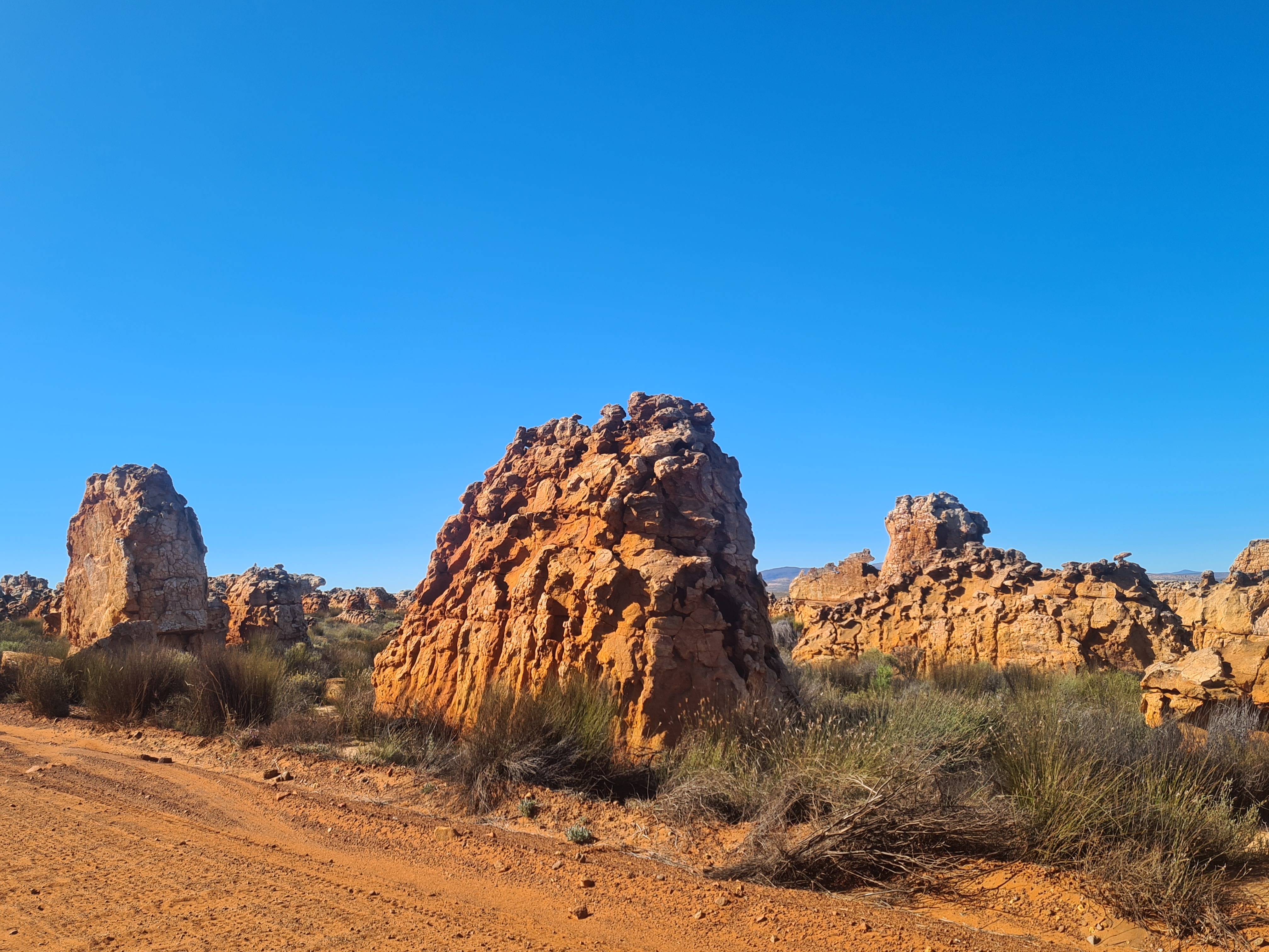 Suntanned sandstone rock formation in stark contrast to the azure blue sky. Image: Carmen Clegg