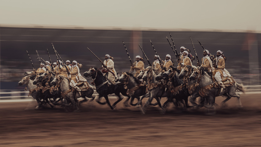 'Knights'. This photograph was taken in November 2022 at a horse festival in Morocco. The picture was taken using a slow shutter speed, while panning the camera to follow the movement of the knights. © Oday Shanshal, United Arab Emirates, Winner, National Awards, Sony World Photography Awards 2023